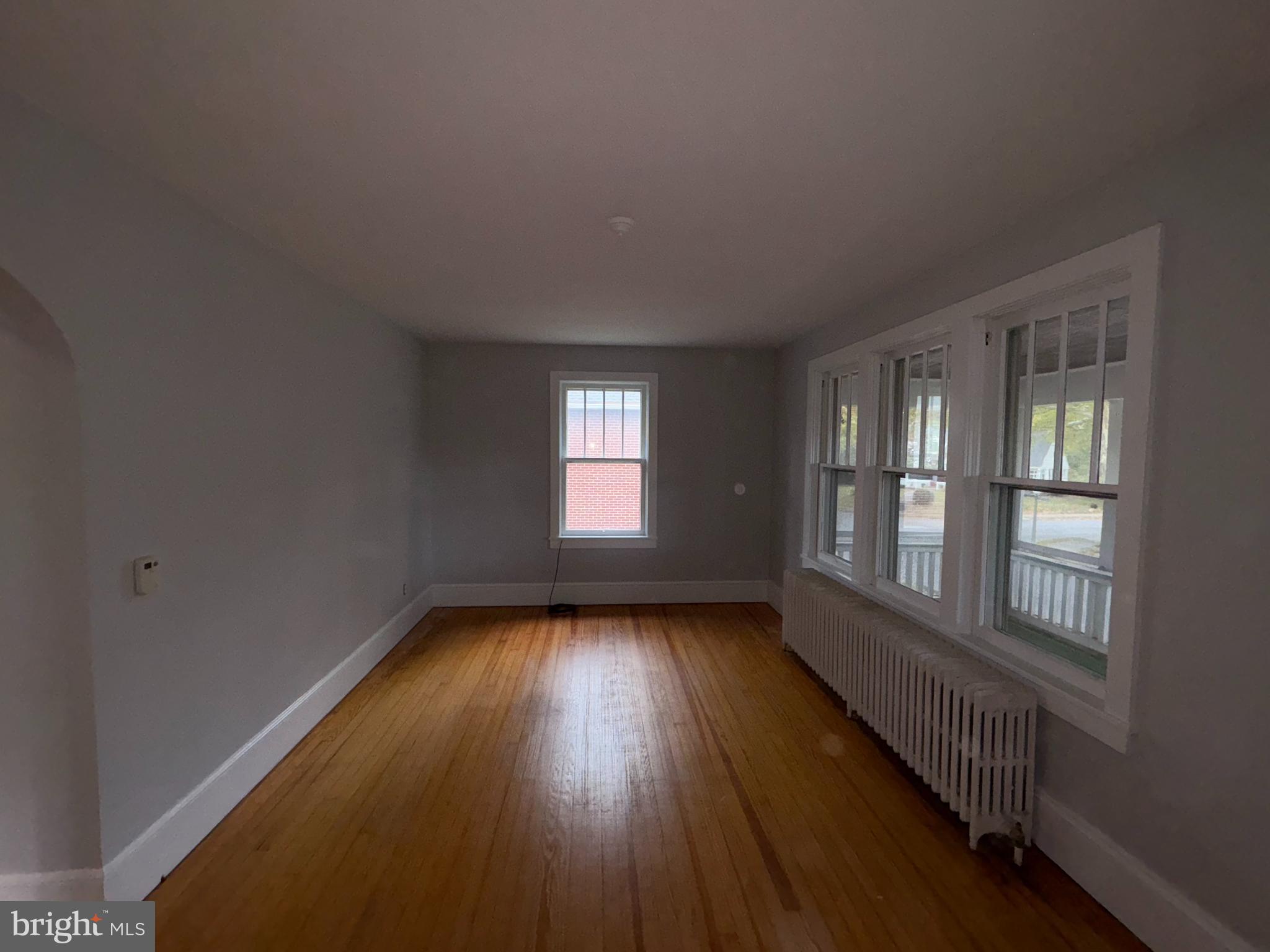 142 Riddle Road Chambersburg, PA 17201 - Photo 22 of 51 a view of an empty room with wooden floor and a window