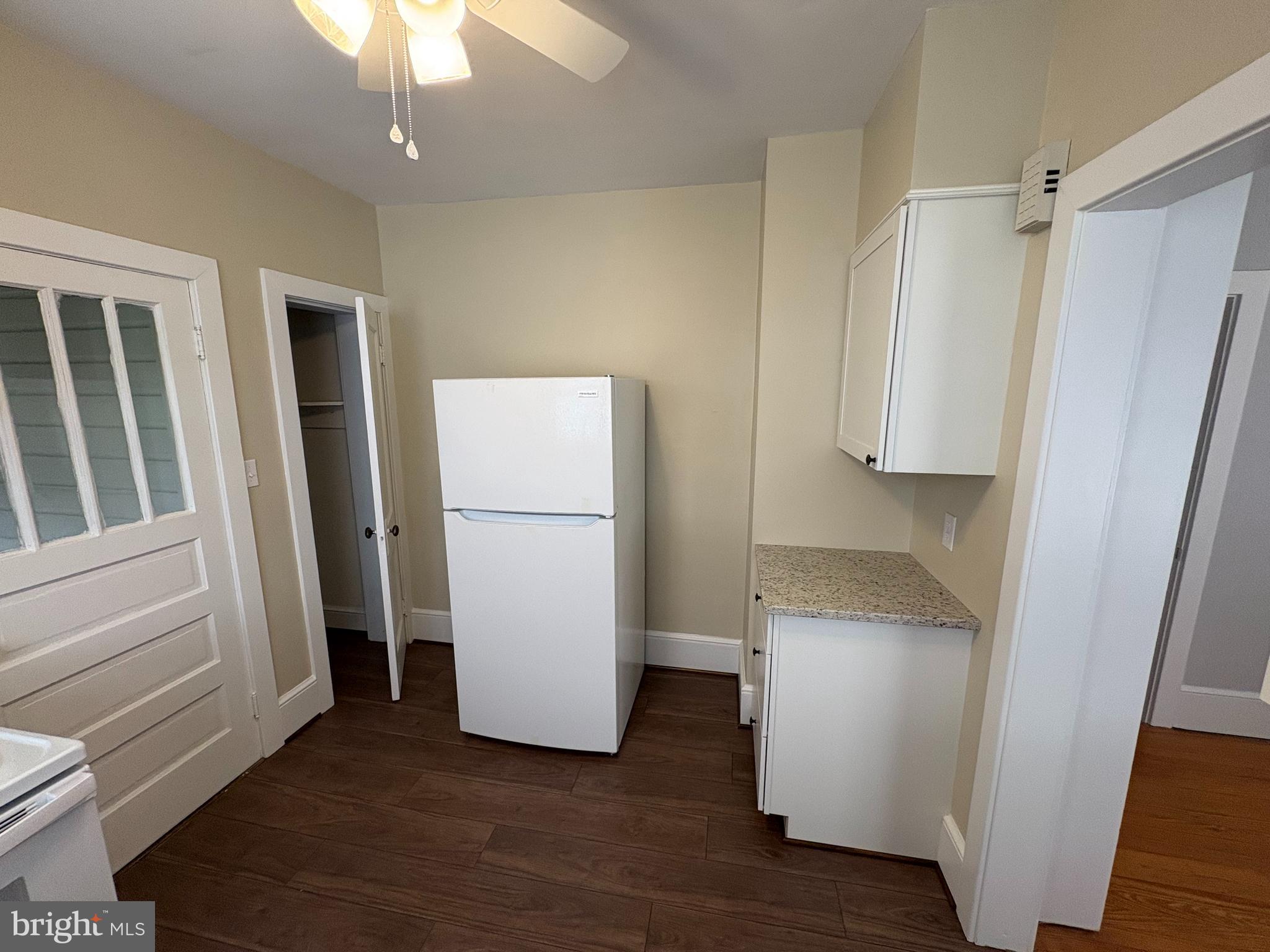 142 Riddle Road Chambersburg, PA 17201 - Photo 26 of 51 a view of walk in closet with hardwood floor and a ceiling fan