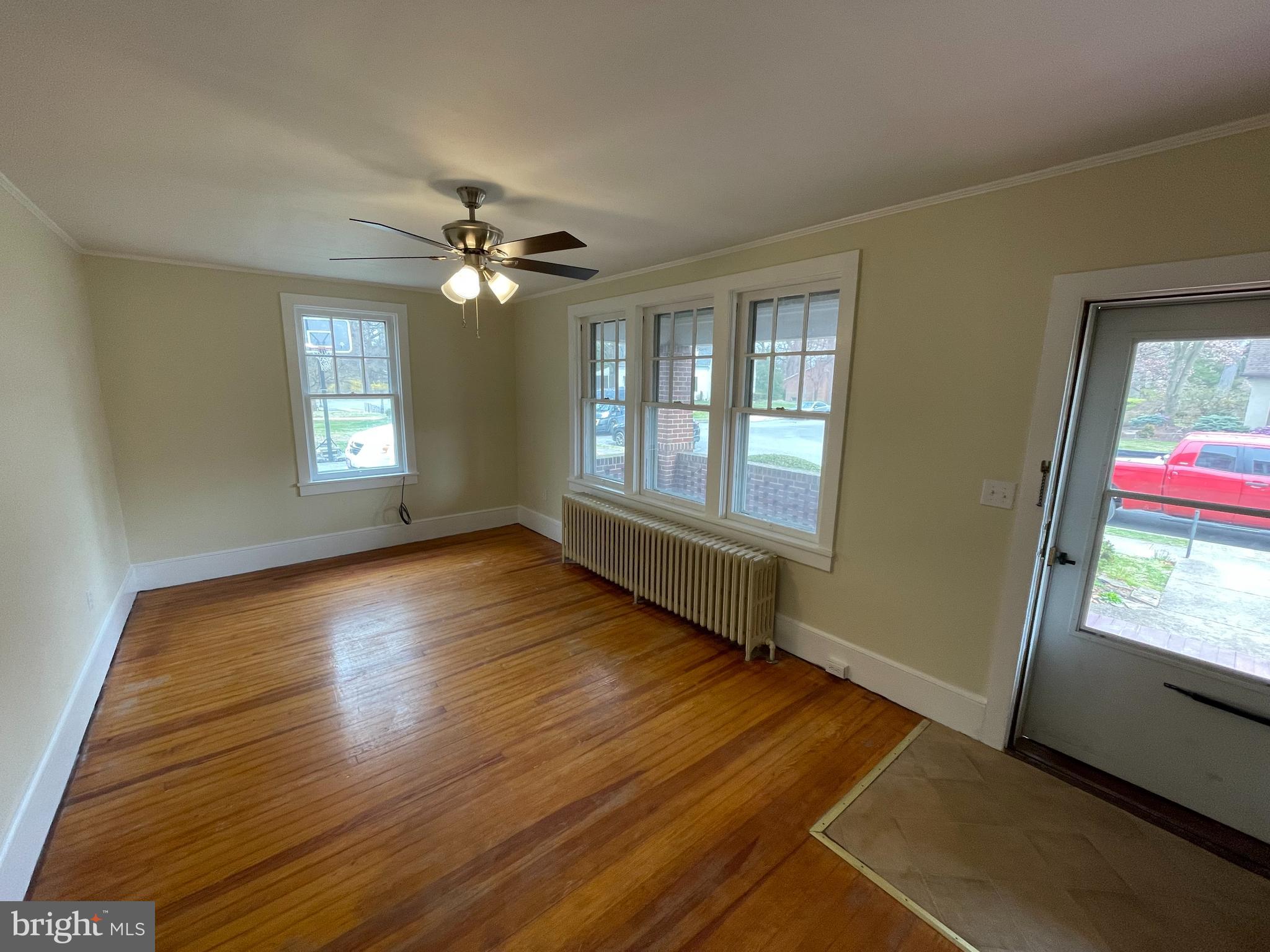142 Riddle Road Chambersburg, PA 17201 - Photo 40 of 51 a view of an empty room with window and wooden floor