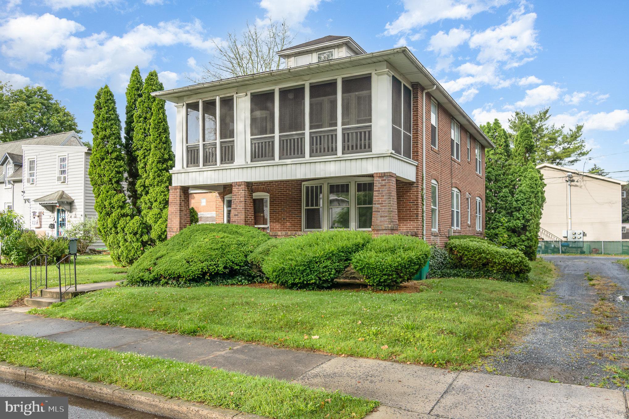 142 Riddle Road Chambersburg, PA 17201 - Photo 4 of 51 a front view of a house with garden and trees