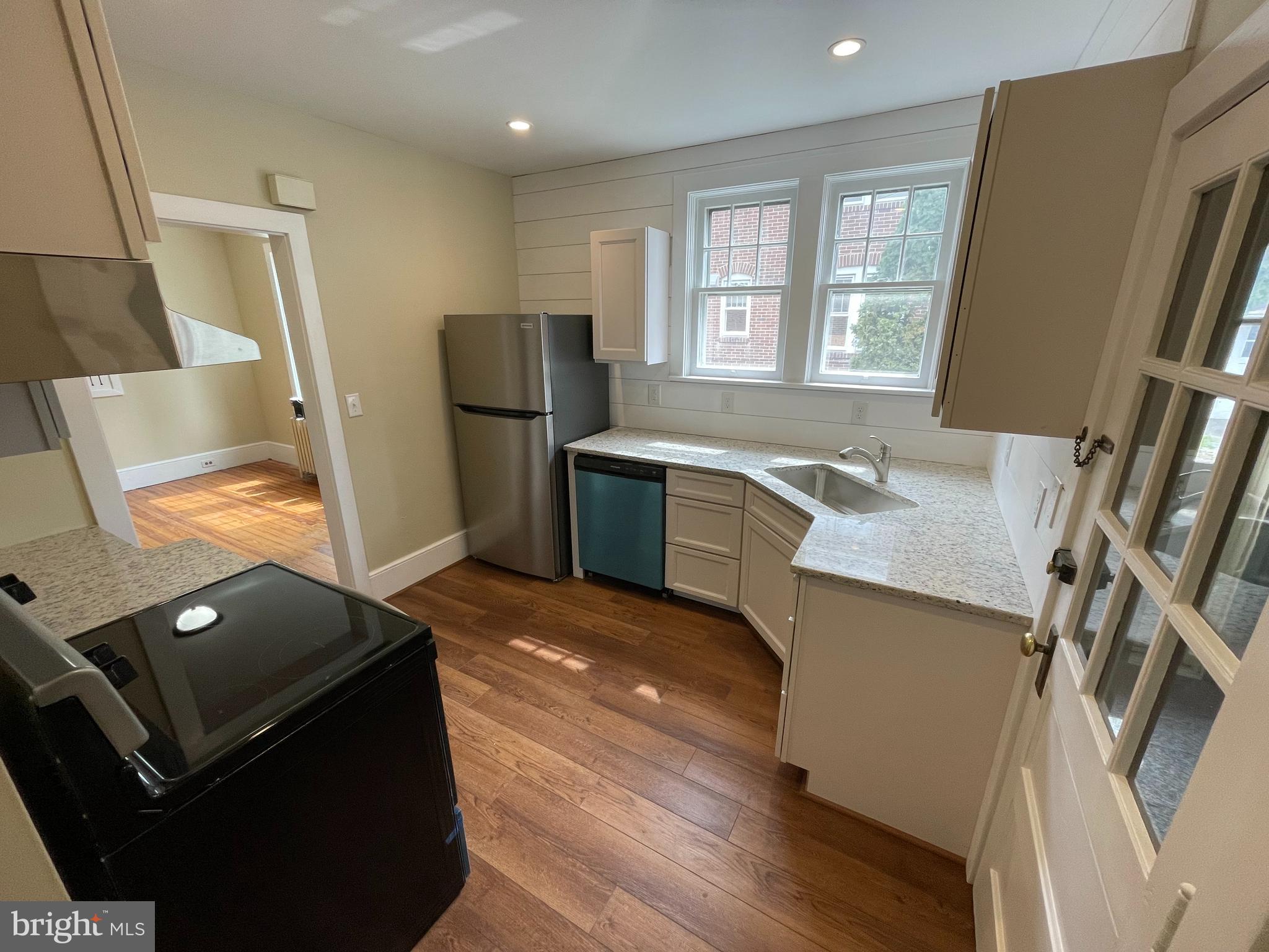 142 Riddle Road Chambersburg, PA 17201 - Photo 44 of 51 a kitchen with stainless steel appliances granite countertop a sink stove and refrigerator