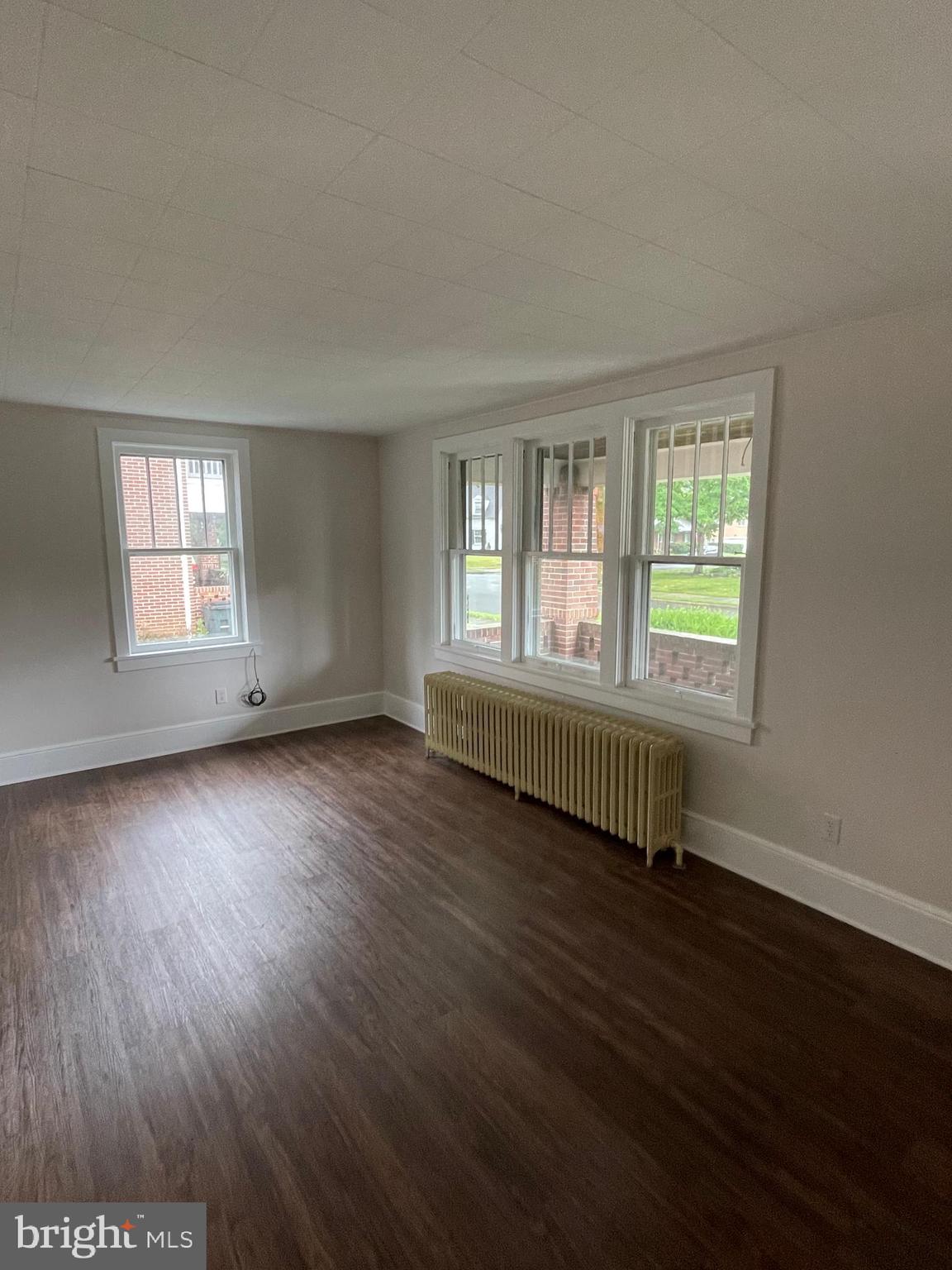 142 Riddle Road Chambersburg, PA 17201 - Photo 6 of 51 an empty room with wooden floor and windows