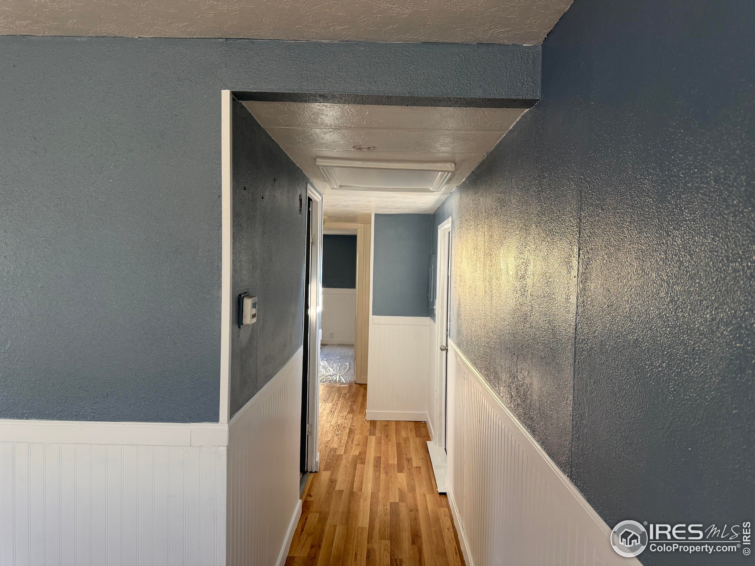 830 1st Street, Unit 23 Pierce, CO 80650 - Photo 8 of 16 a view of hallway with wooden floor