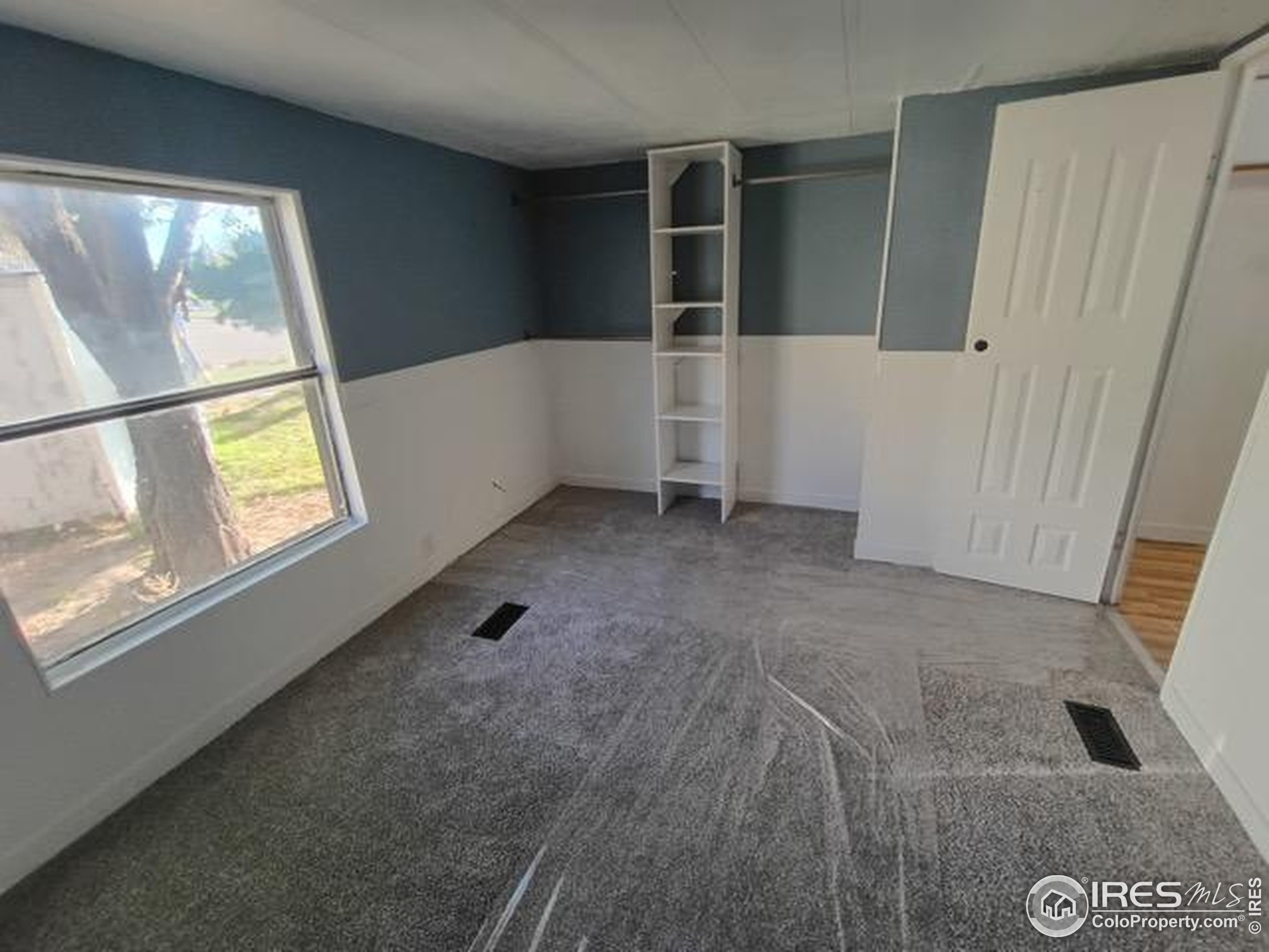 830 1st Street, Unit 23 Pierce, CO 80650 - Photo 10 of 16 an empty room with windows