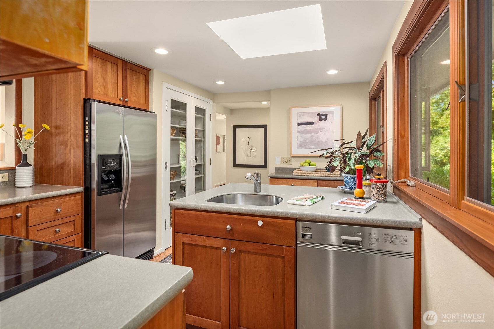 2650 Perkins Lane West Seattle, WA 98199 - Photo 12 of 30 a kitchen with stainless steel appliances a sink stove and refrigerator
