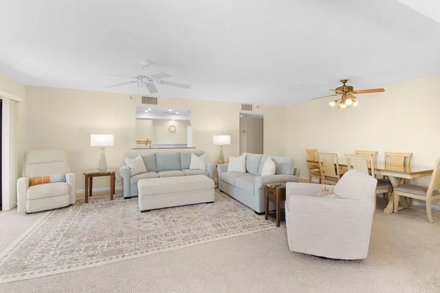 a bedroom with a bed a large window with outer view and couch