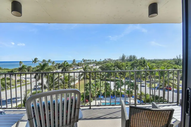 a bathroom with a toilet a sink a mirror a vanity and shower