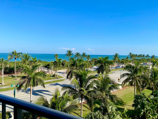 a view of a building next to a yard