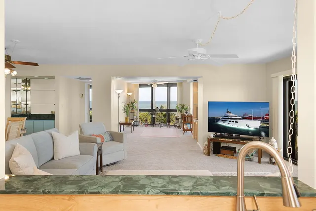 a view of a balcony with a yard