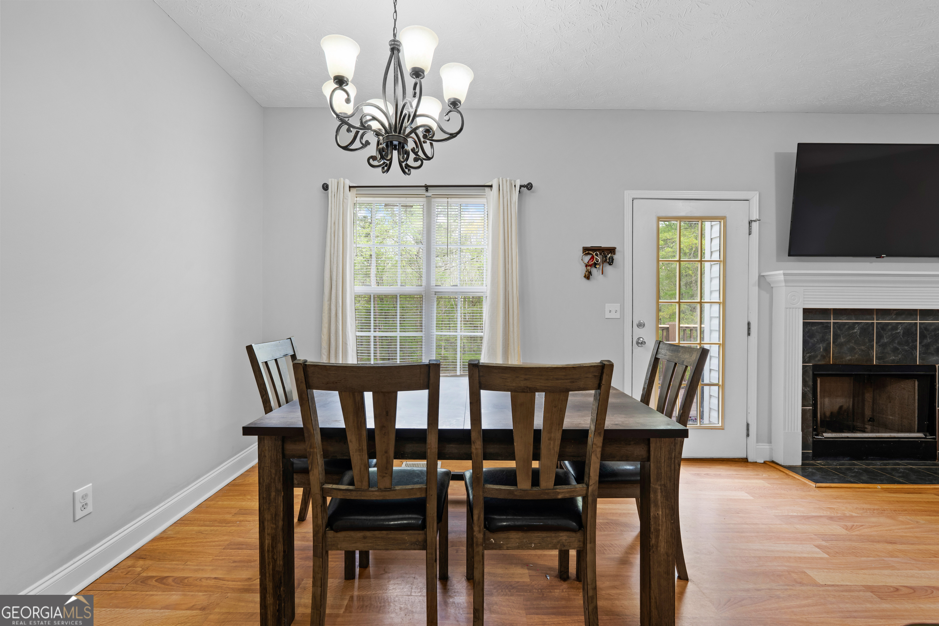 35 South Robin Lane Newnan, GA 30263 - Photo 13 of 50 a view of a dining room with furniture wooden floor and a chandelier