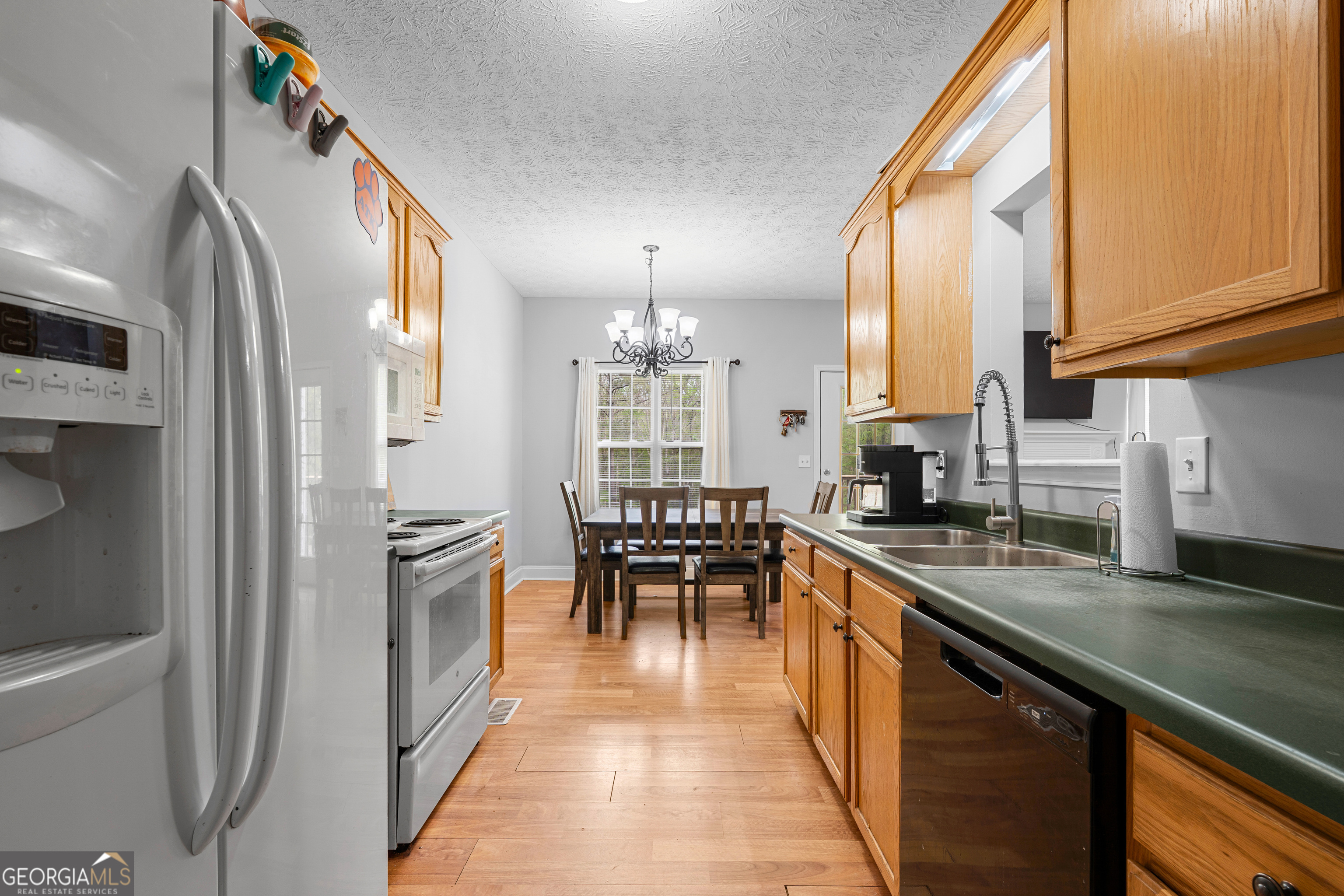35 South Robin Lane Newnan, GA 30263 - Photo 14 of 50 a kitchen with granite countertop lots of counter top space