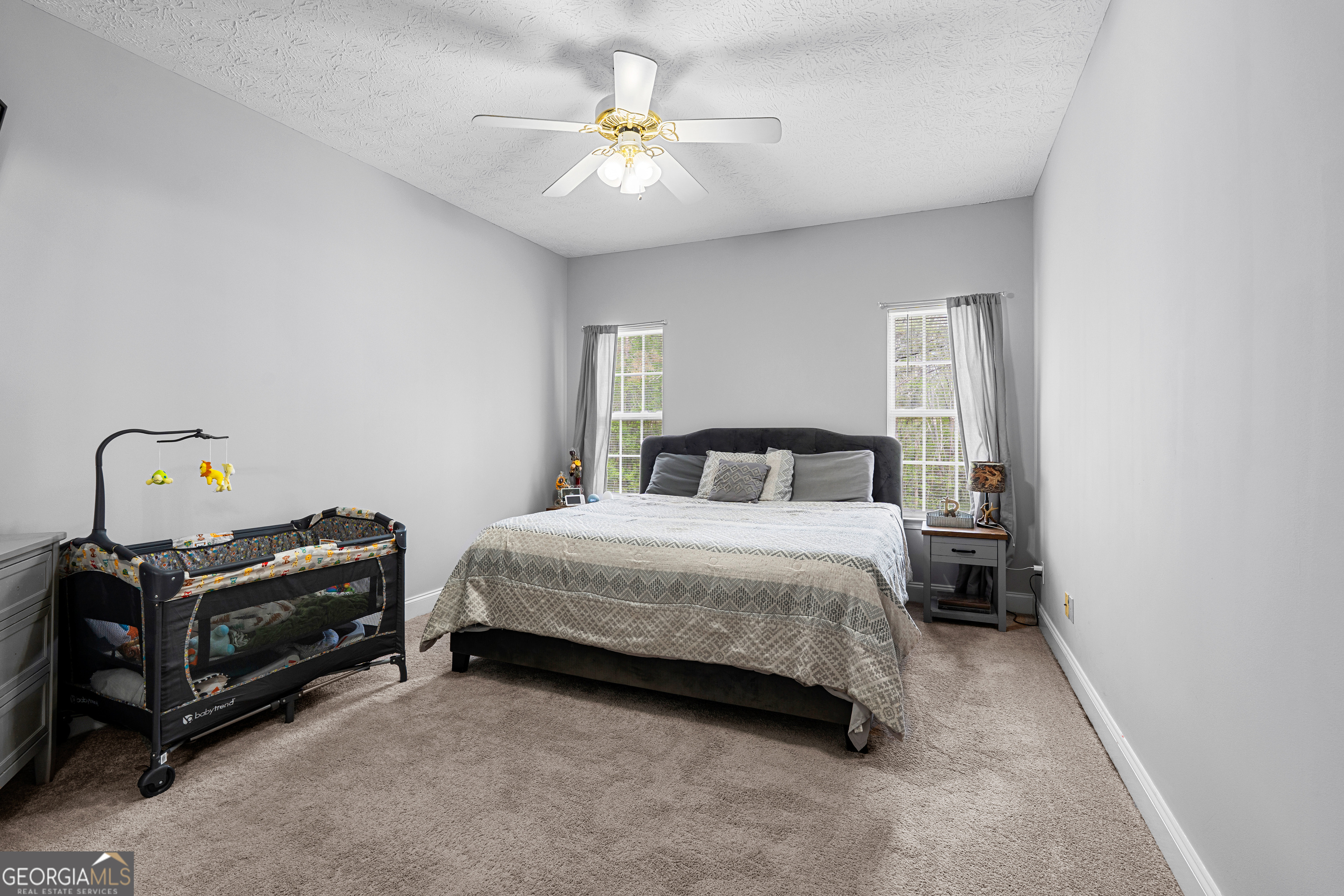 35 South Robin Lane Newnan, GA 30263 - Photo 16 of 50 a bedroom with a bed and a ceiling fan