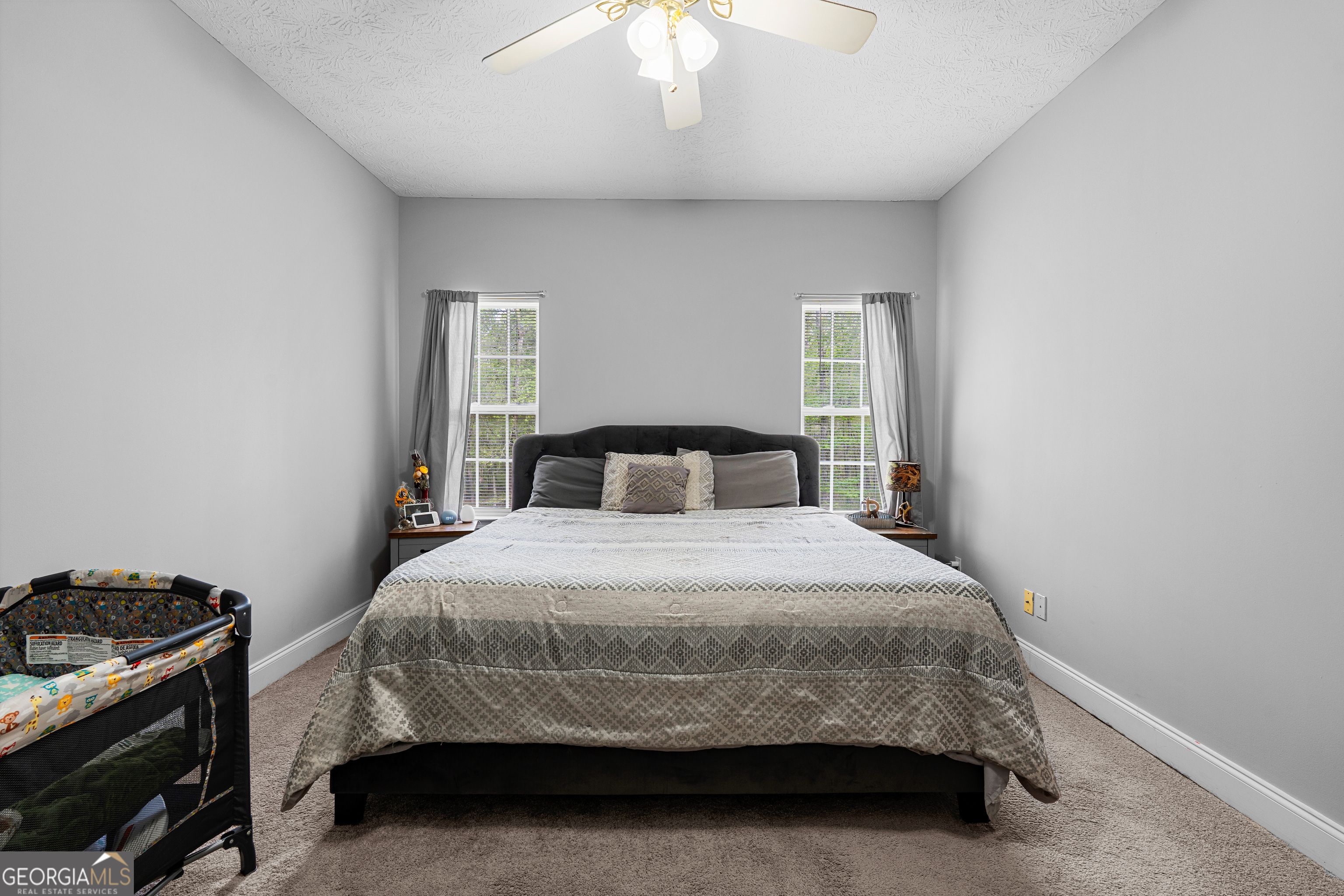35 South Robin Lane Newnan, GA 30263 - Photo 17 of 50 a bedroom with a bed and a chandelier