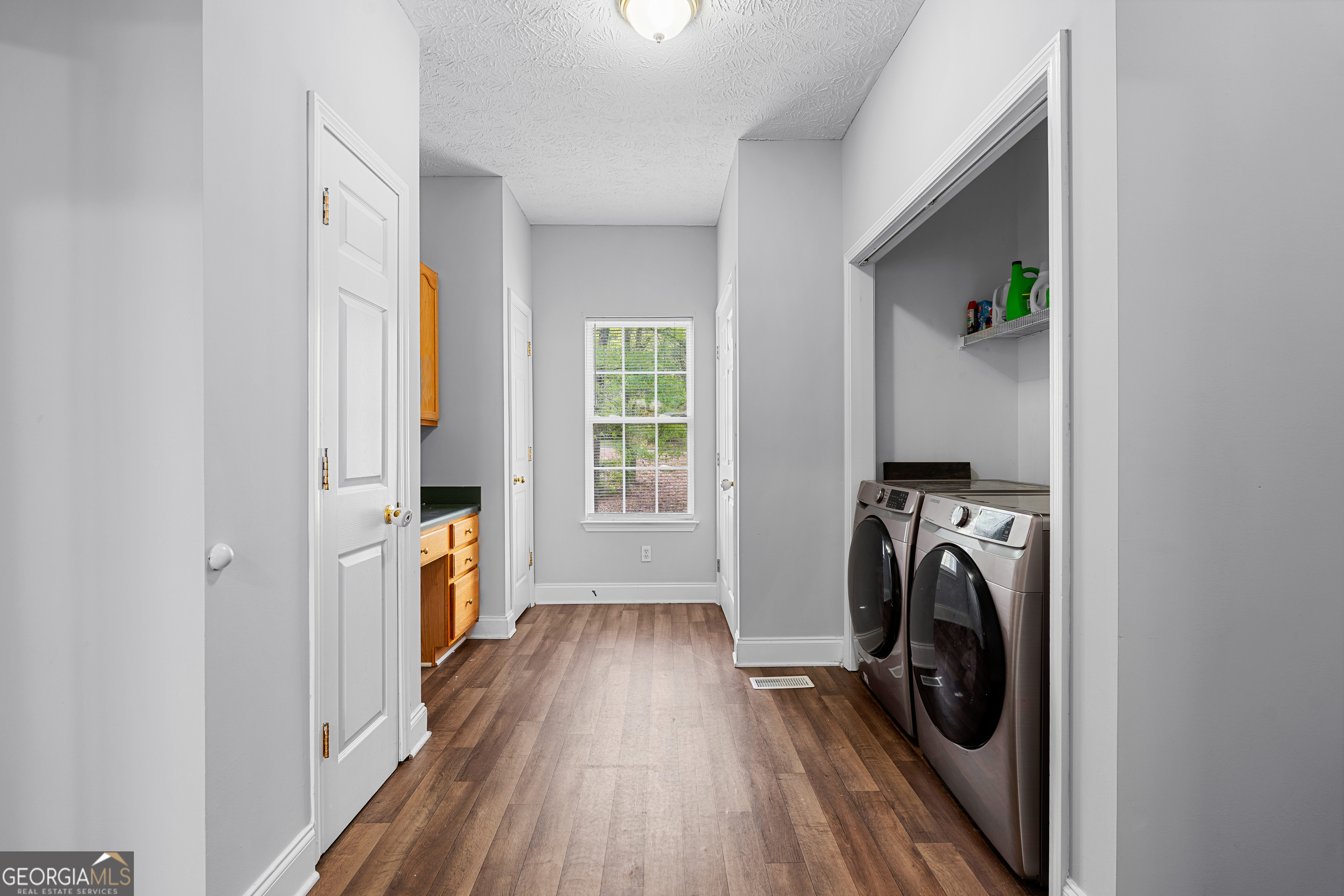 35 South Robin Lane Newnan, GA 30263 - Photo 21 of 50 a view of a hallway with washer and dryer