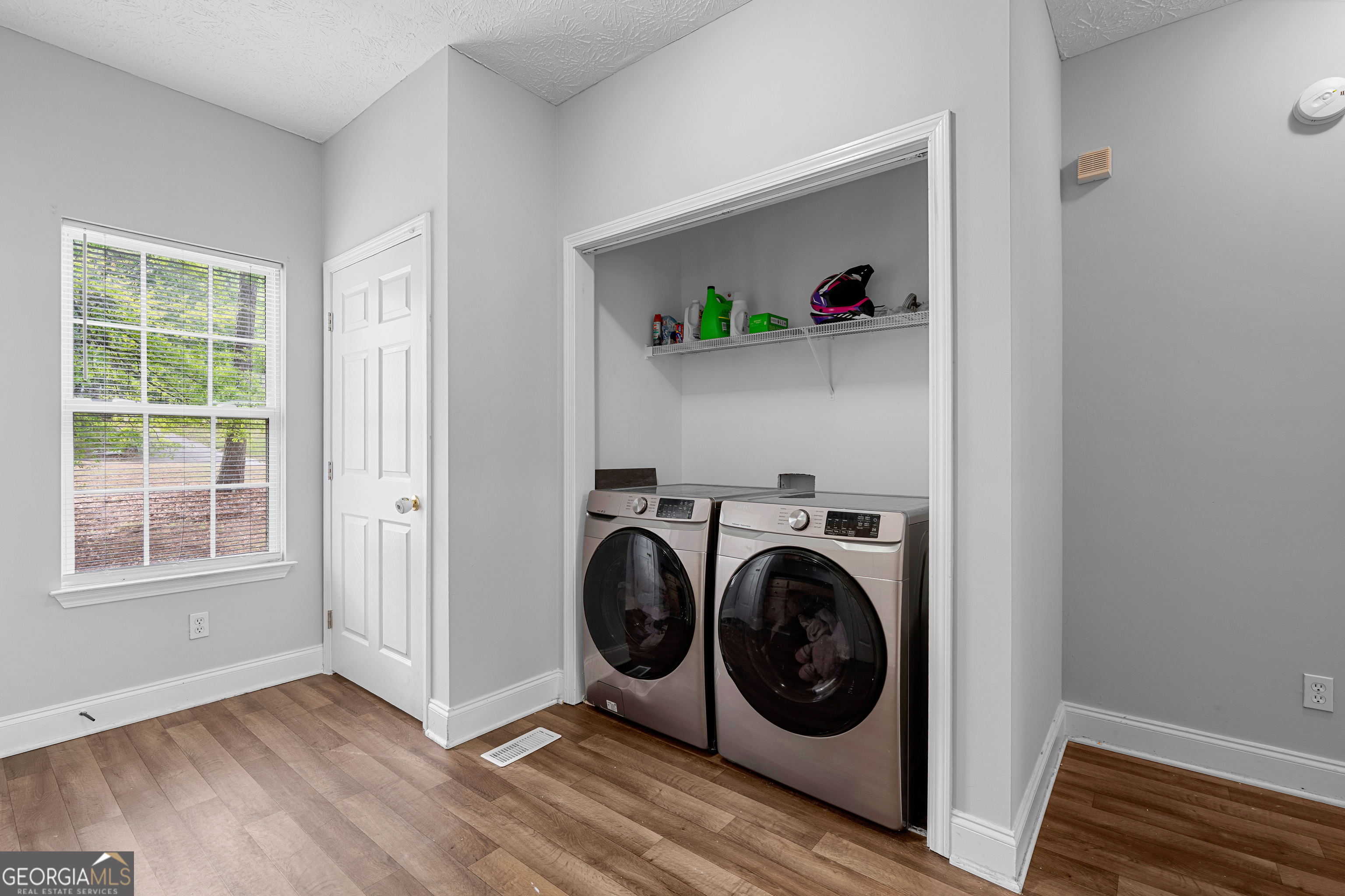 35 South Robin Lane Newnan, GA 30263 - Photo 22 of 50 a view of a hallway with washer and dryer