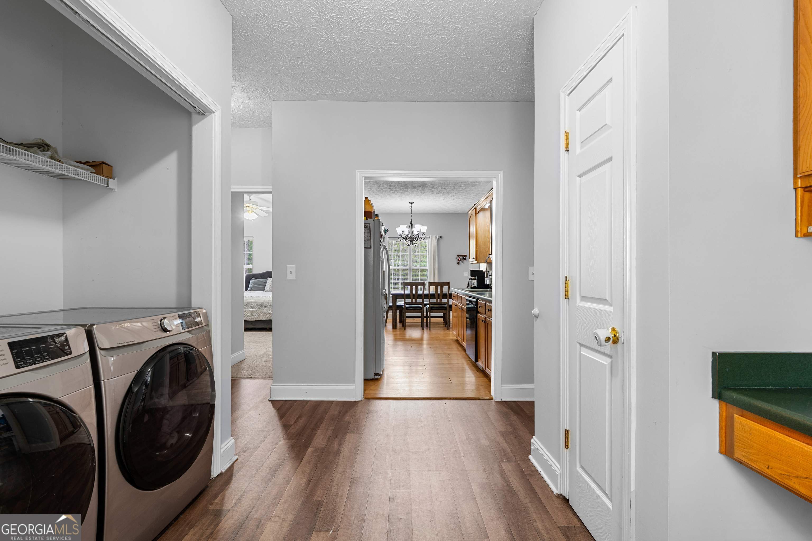 35 South Robin Lane Newnan, GA 30263 - Photo 23 of 50 a view of a hallway with washer and dryer