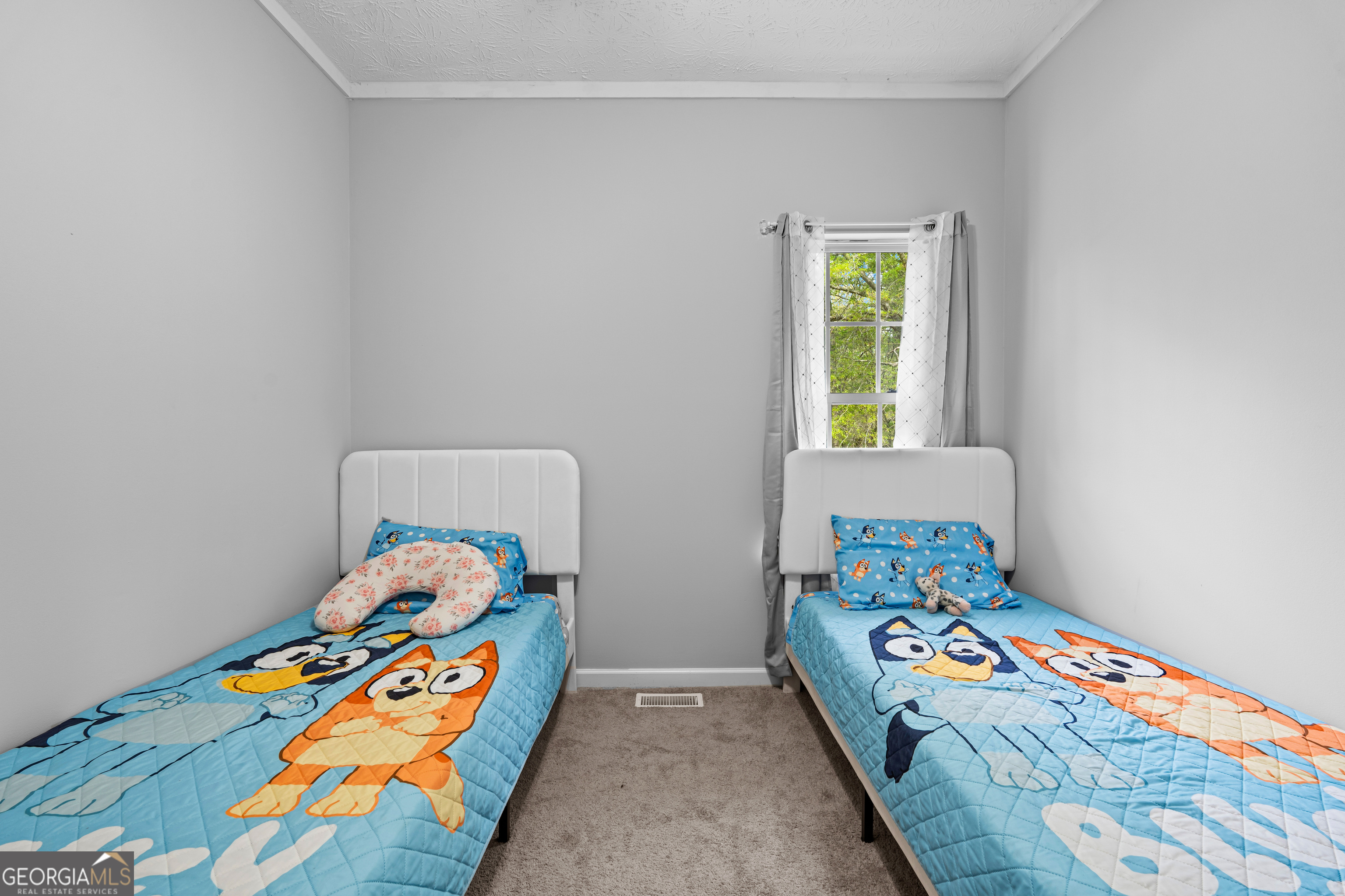 35 South Robin Lane Newnan, GA 30263 - Photo 25 of 50 a bedroom with a bed and window