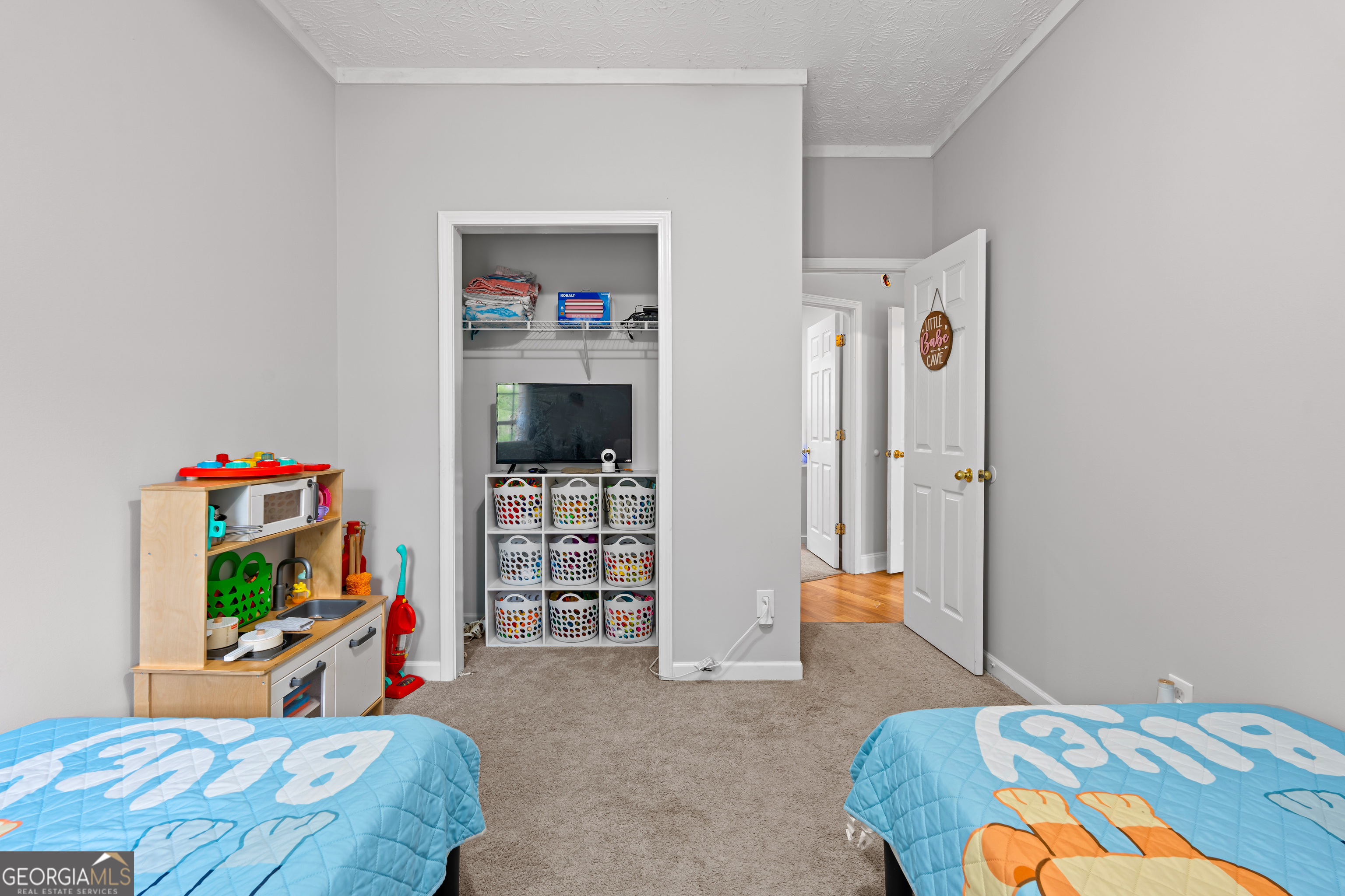 35 South Robin Lane Newnan, GA 30263 - Photo 26 of 50 a bedroom with a bed and a television