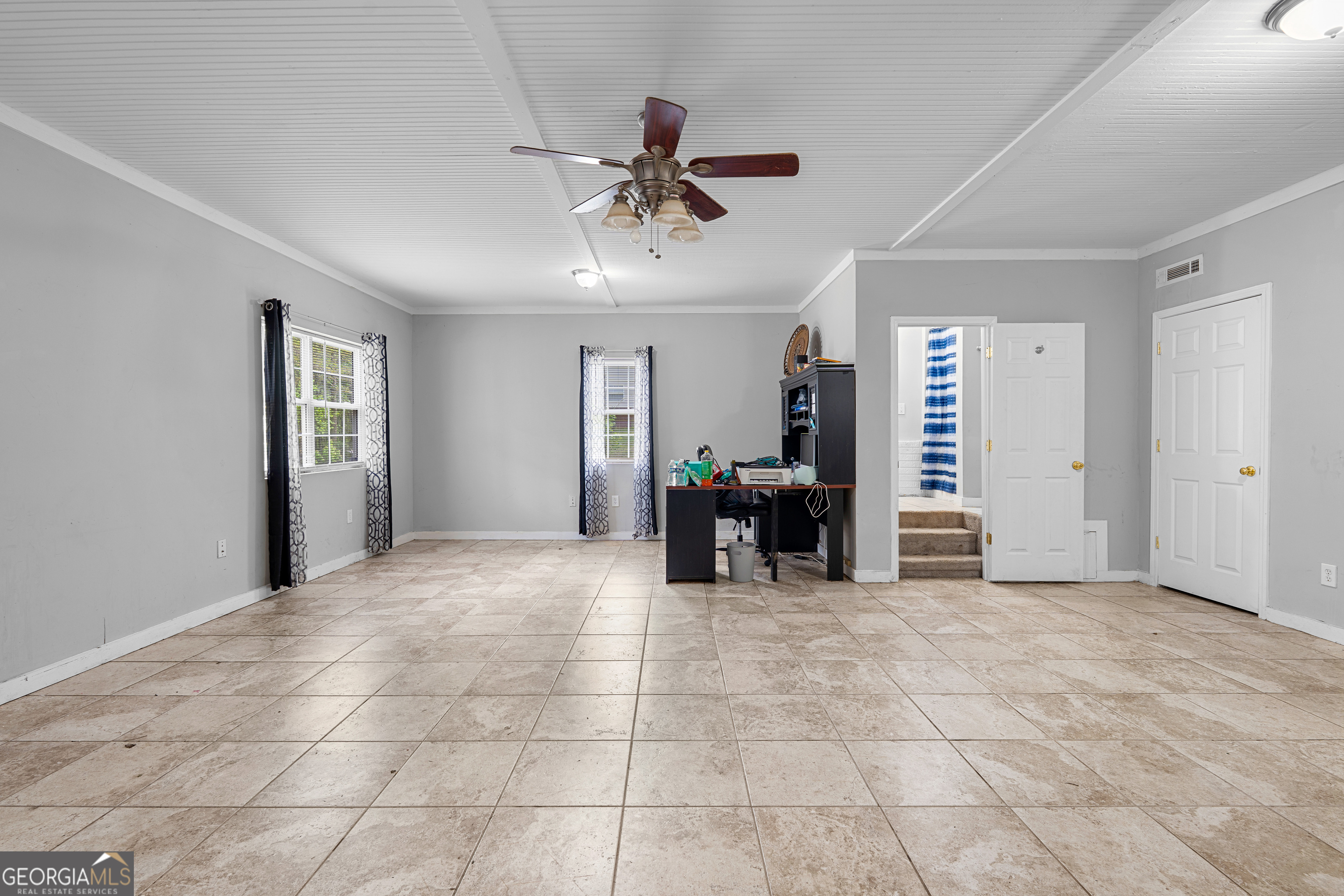 35 South Robin Lane Newnan, GA 30263 - Photo 36 of 50 a view of a livingroom with a patio and a ceiling fan