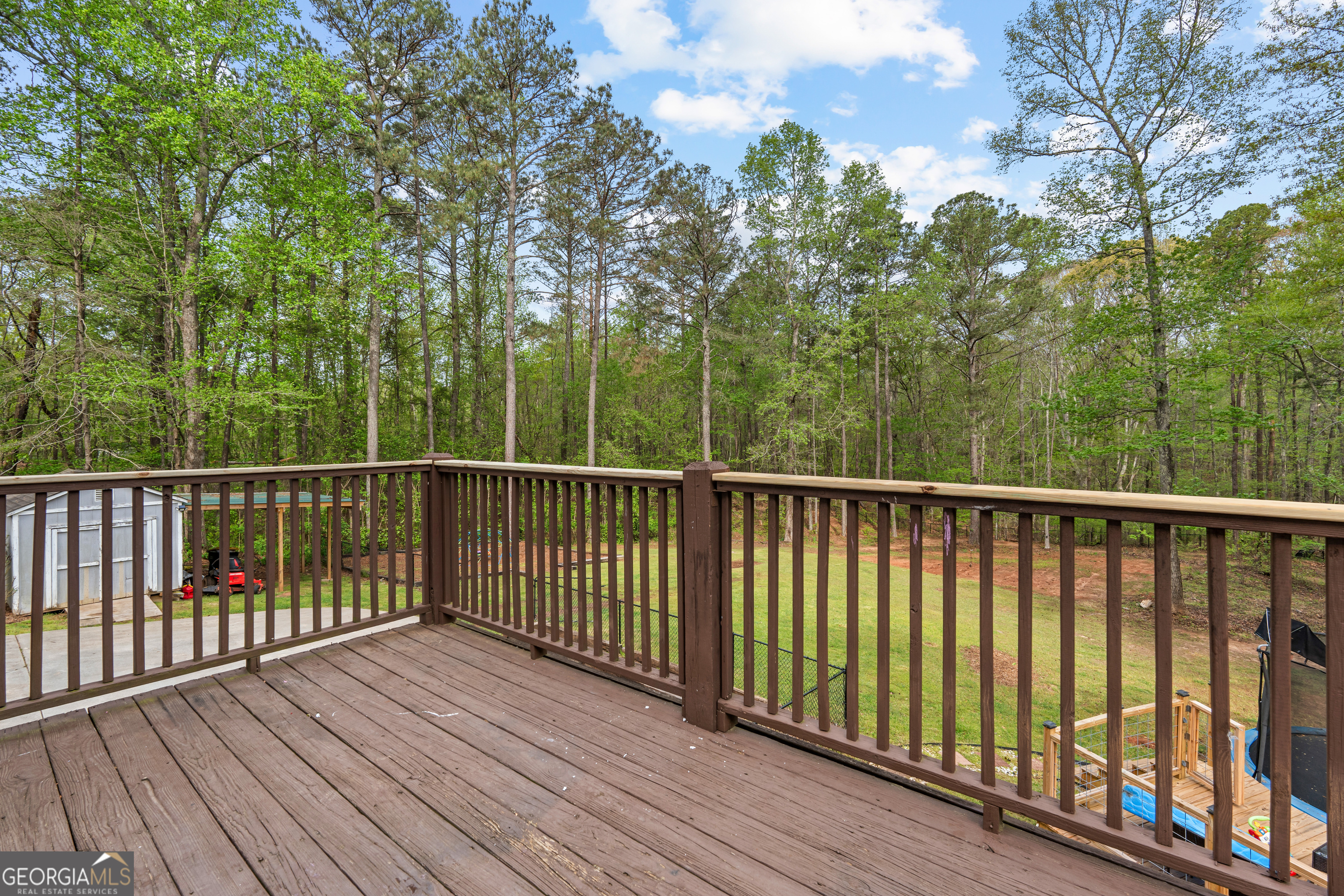 35 South Robin Lane Newnan, GA 30263 - Photo 41 of 50 a view of a wooden roof deck