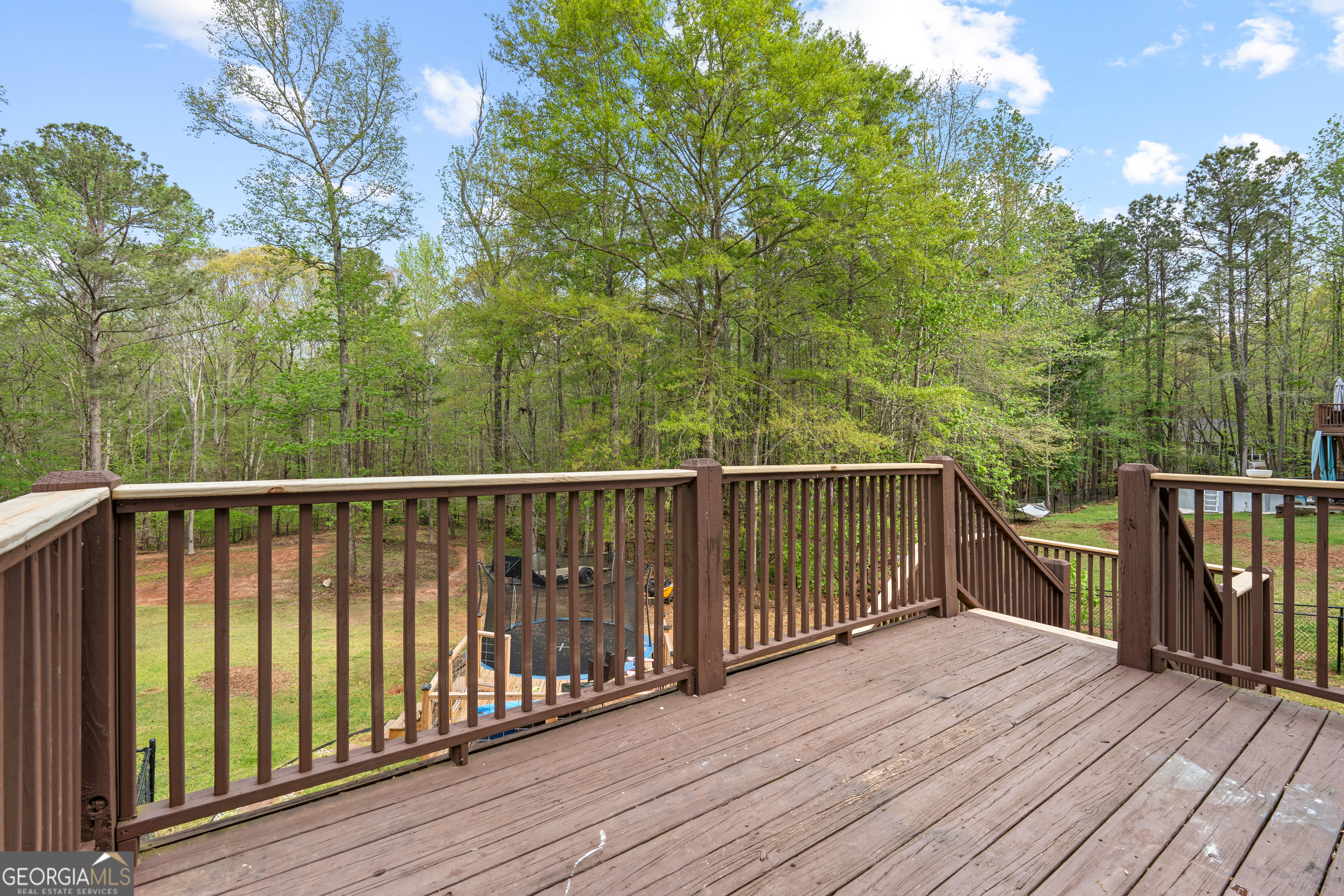 35 South Robin Lane Newnan, GA 30263 - Photo 42 of 50 a balcony with wooden floor and fence
