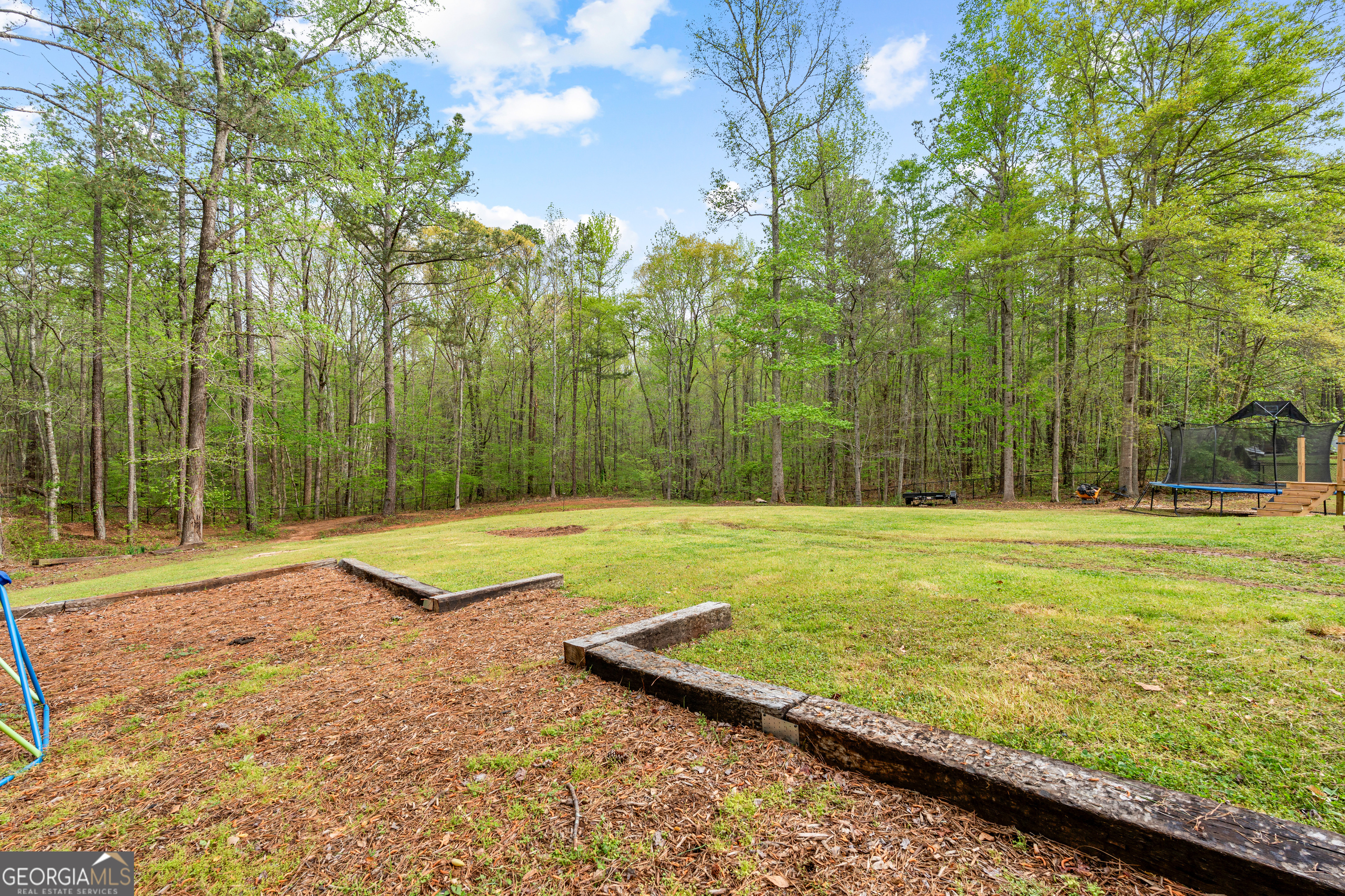 35 South Robin Lane Newnan, GA 30263 - Photo 49 of 50 a view of a pool with a yard