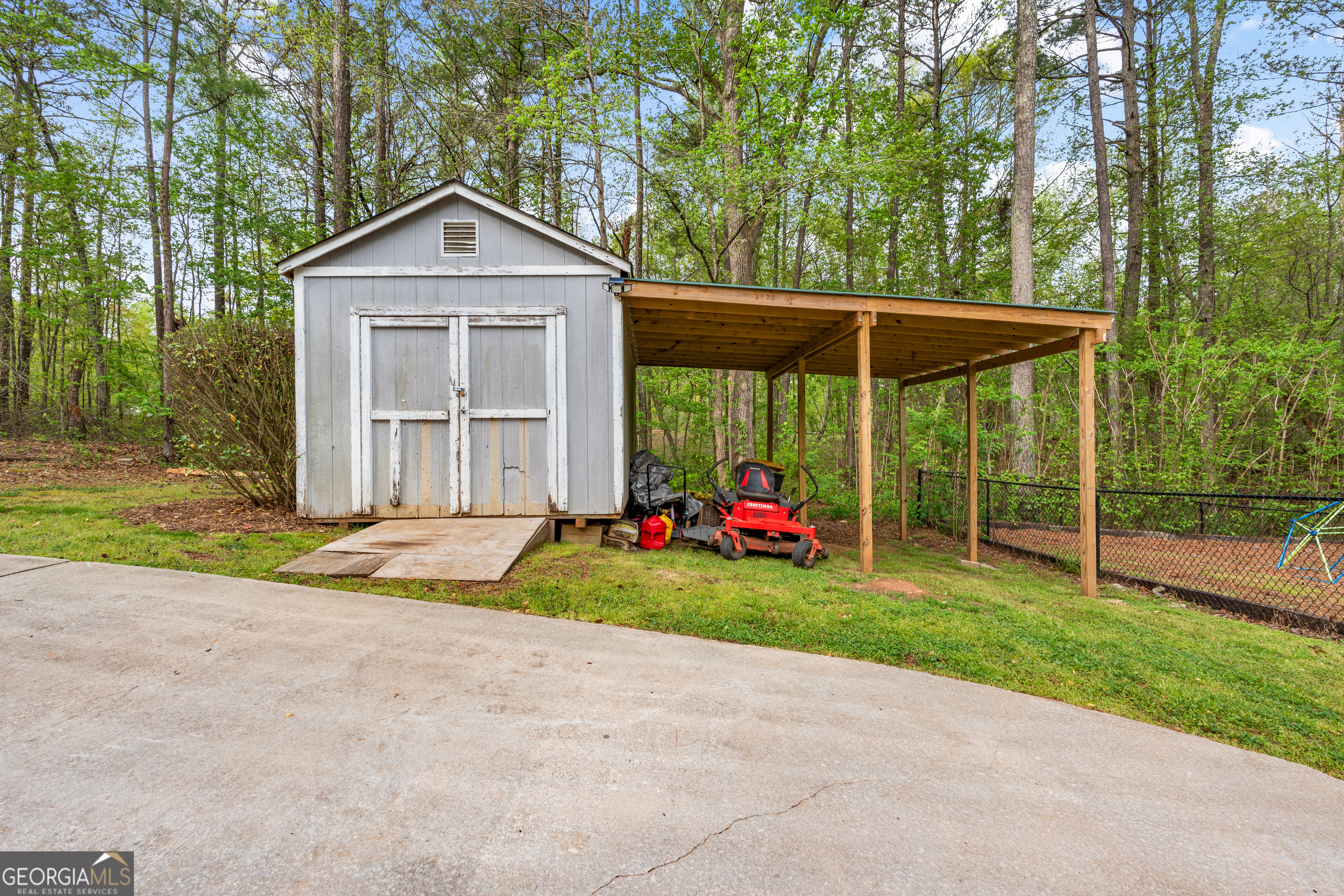 35 South Robin Lane Newnan, GA 30263 - Photo 50 of 50 a view of a house with backyard and trees