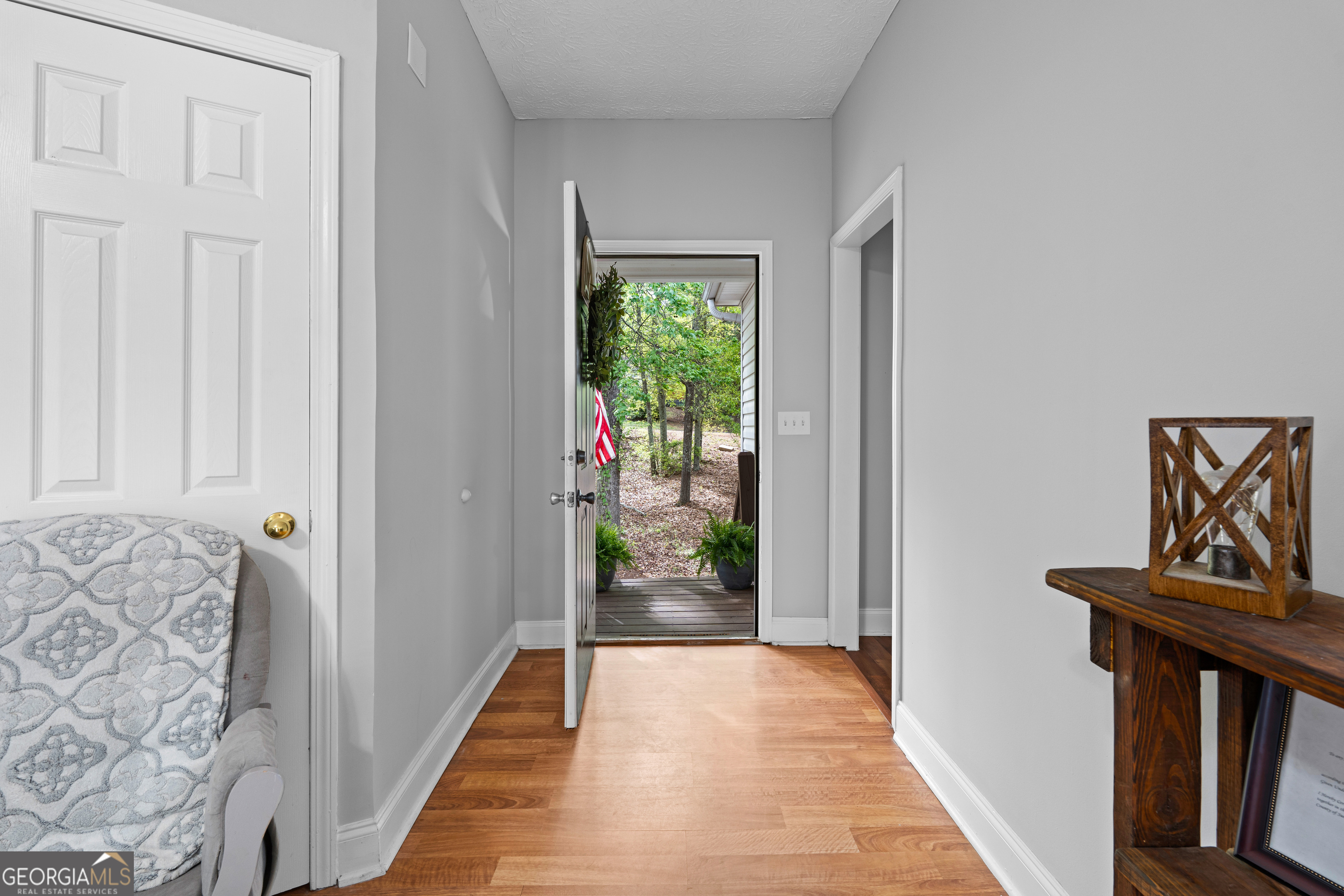 35 South Robin Lane Newnan, GA 30263 - Photo 5 of 50 a view of a hallway to a livingroom with furniture