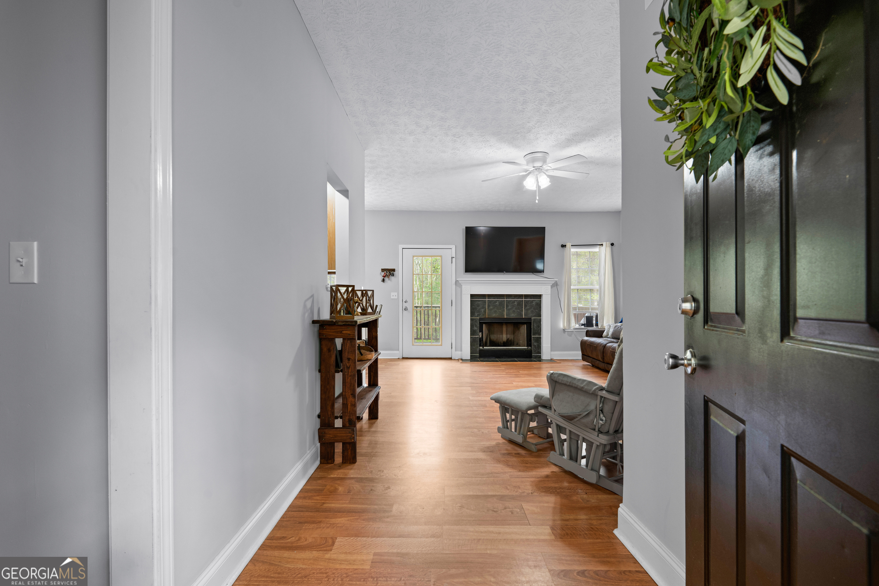 35 South Robin Lane Newnan, GA 30263 - Photo 6 of 50 a living room with furniture and a fireplace