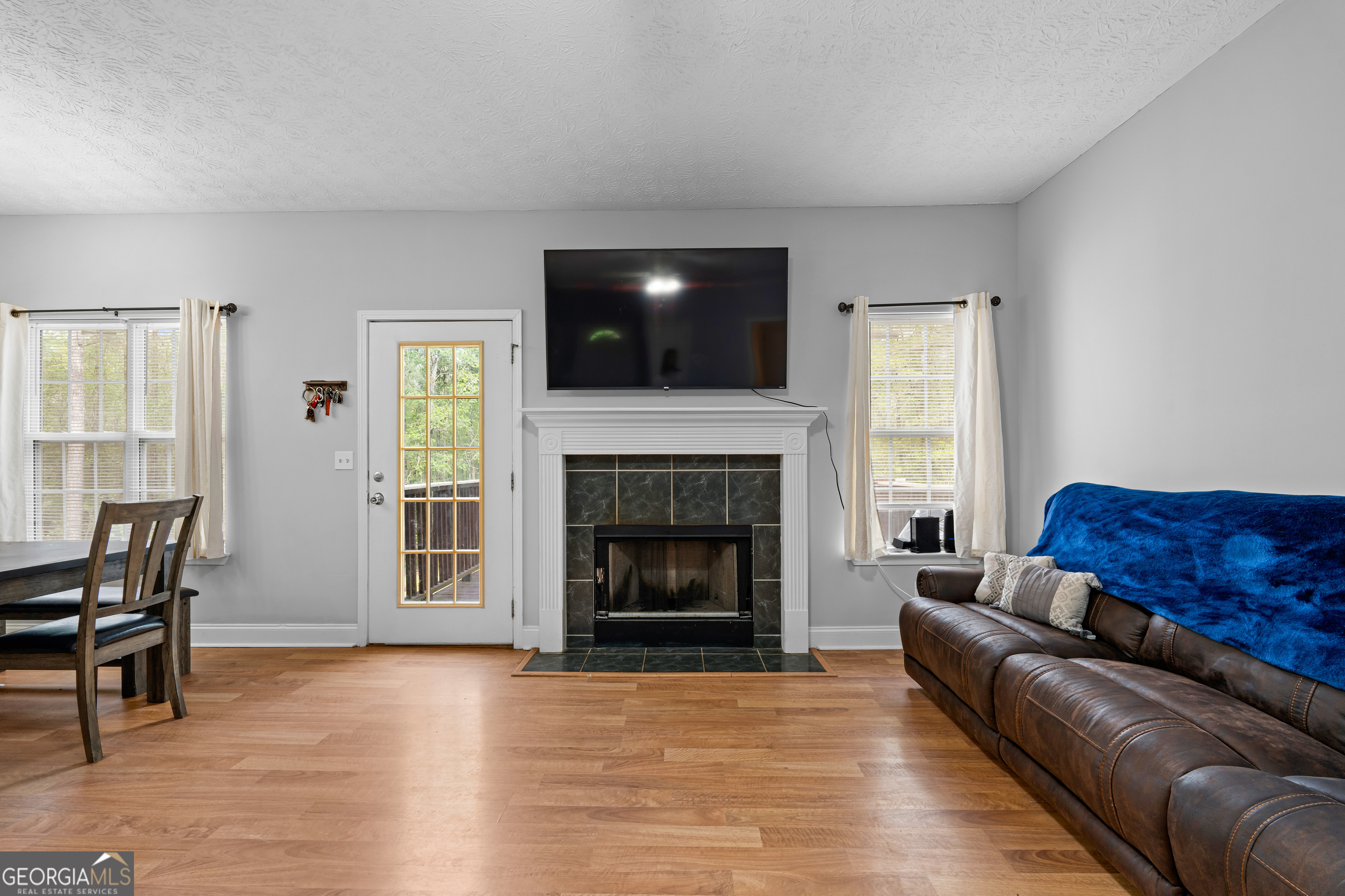 35 South Robin Lane Newnan, GA 30263 - Photo 8 of 50 a living room with furniture and a fireplace