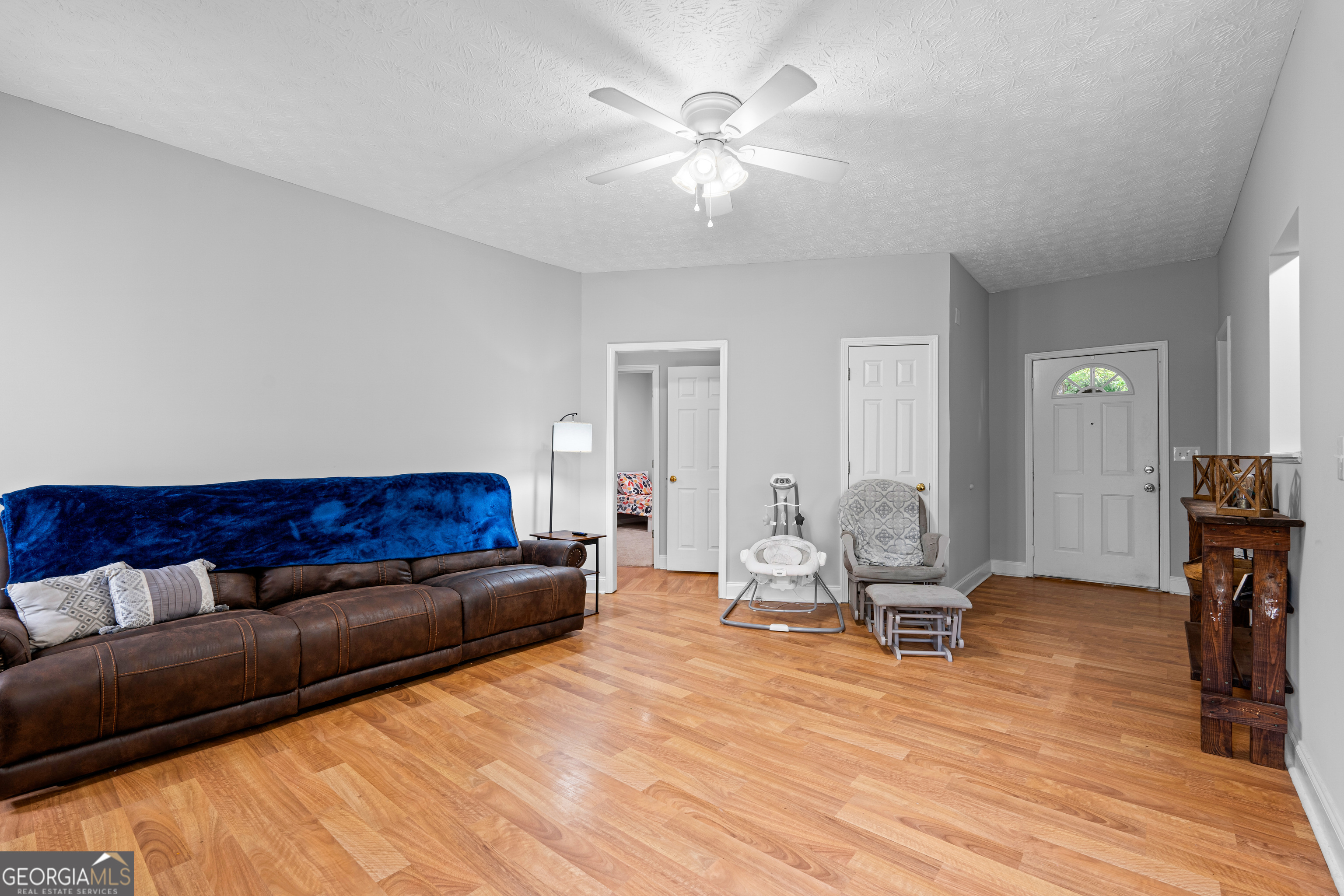 35 South Robin Lane Newnan, GA 30263 - Photo 10 of 50 a living room with furniture and a wooden floor