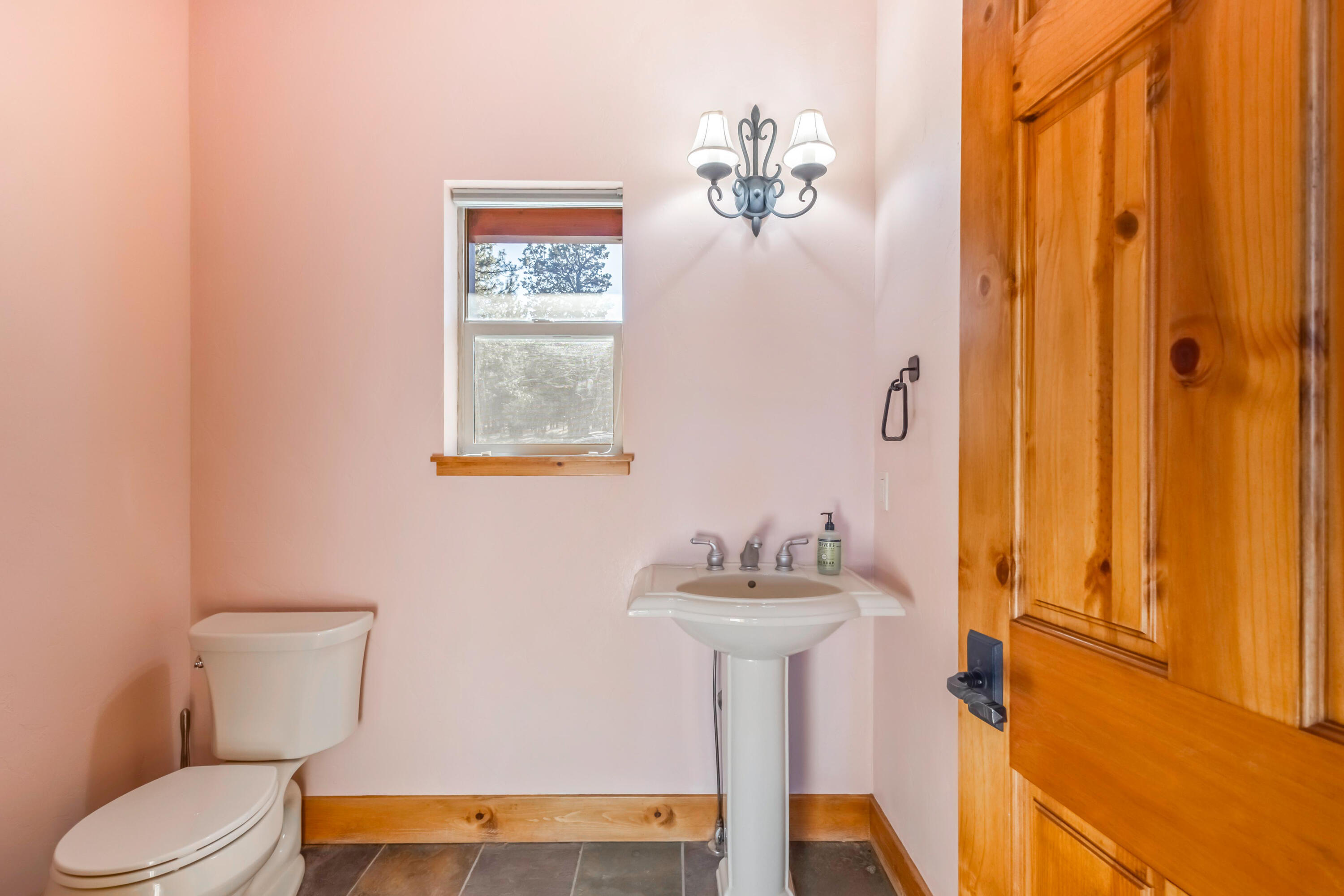 69590 Omaha Road Sisters, OR 97759 - Photo 32 of 46 a bathroom with a sink mirror and toilet