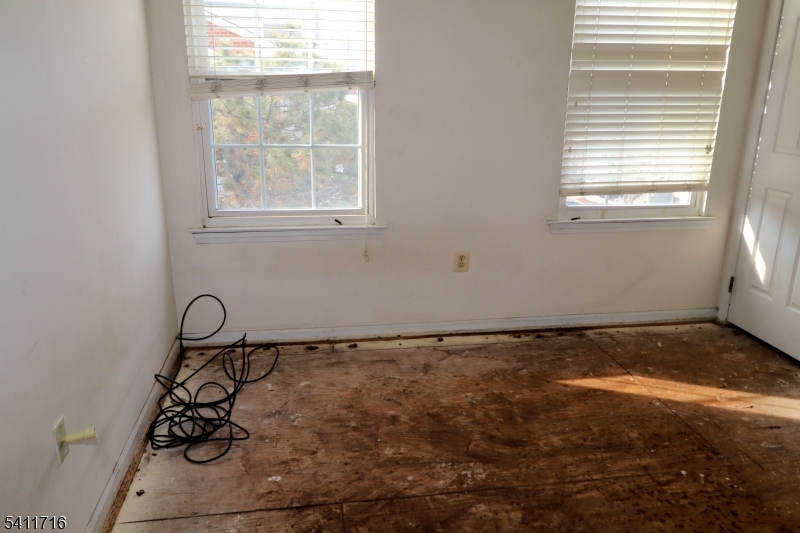 12 Rutgers Drive, Unit 12 Newark, NJ 07103 - Photo 22 of 22 a room with window and a rug