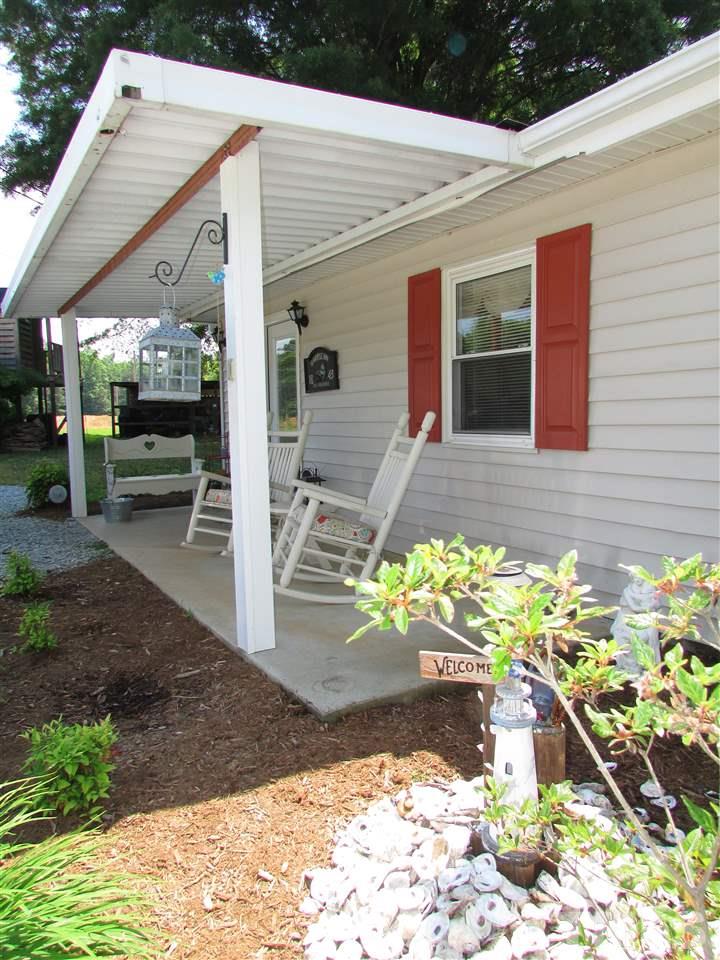 1231 Chambers Loop Road Timberlake, NC 27583 - Photo 2 of 22 Enjoy summer breezes, birds chirping and country living as you sit on the covered porch