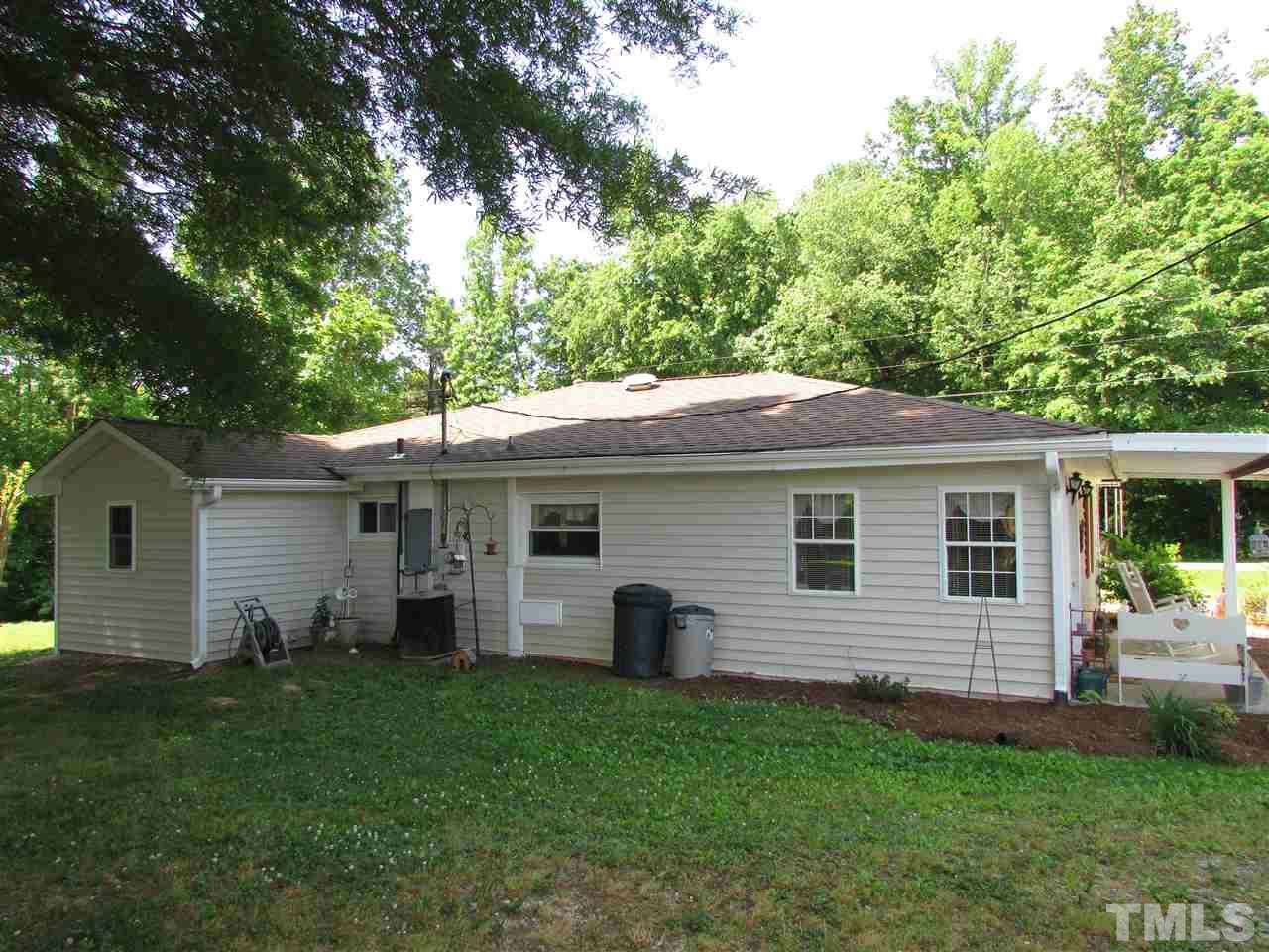 1231 Chambers Loop Road Timberlake, NC 27583 - Photo 14 of 22 Back side of house has lots of summer shade.