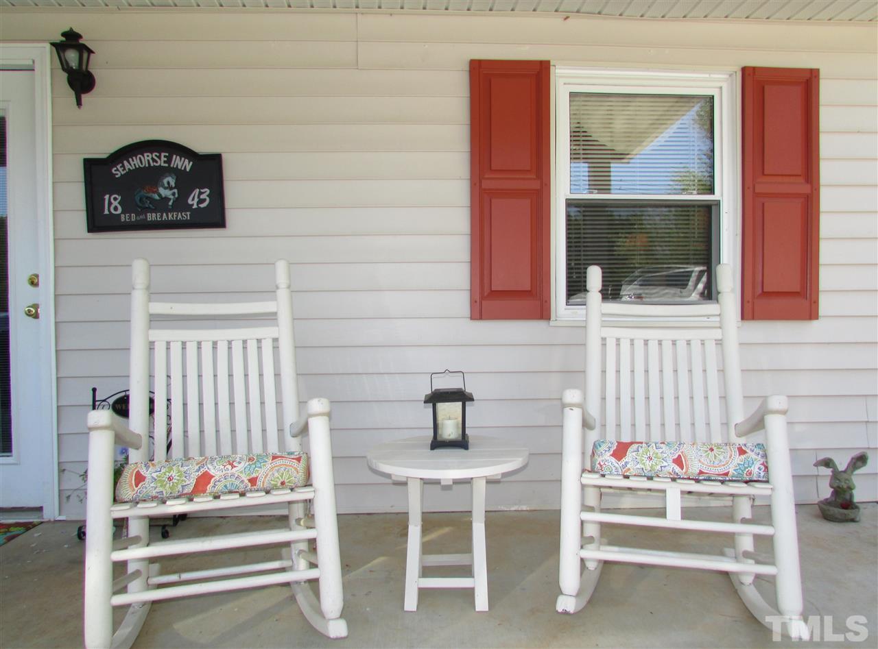 1231 Chambers Loop Road Timberlake, NC 27583 - Photo 3 of 22 You and your guest will enjoy rocking on the covered porch even in a little rain shower