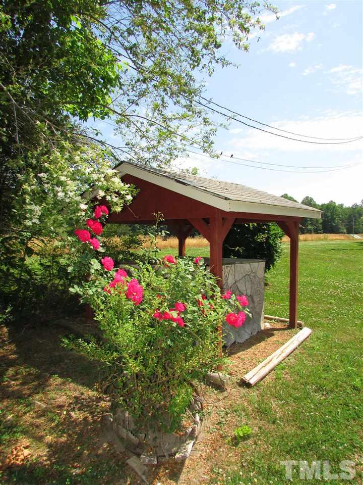 1231 Chambers Loop Road Timberlake, NC 27583 - Photo 21 of 22 Even have flowers planted at the well house to give you a warm welcome as you turn in the drive