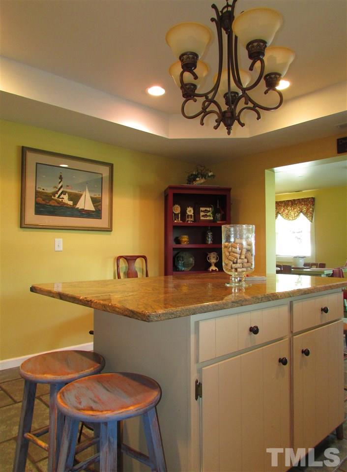 1231 Chambers Loop Road Timberlake, NC 27583 - Photo 7 of 22 Great eat at bar with granite counter top. Everyone will want to hang out in the kitchen.