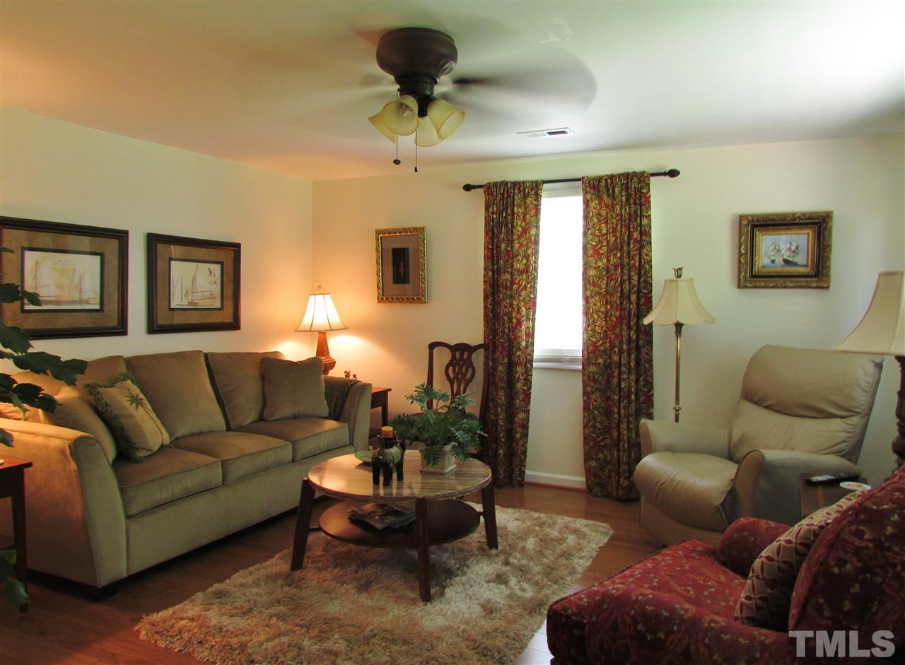 1231 Chambers Loop Road Timberlake, NC 27583 - Photo 8 of 22 Spacious living with new laminate flooring.