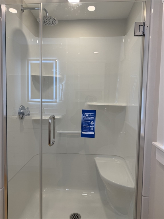15 River Street, Unit 1 Beverly, MA 01915 - Photo 15 of 17 a bathroom with a shower and bathtub