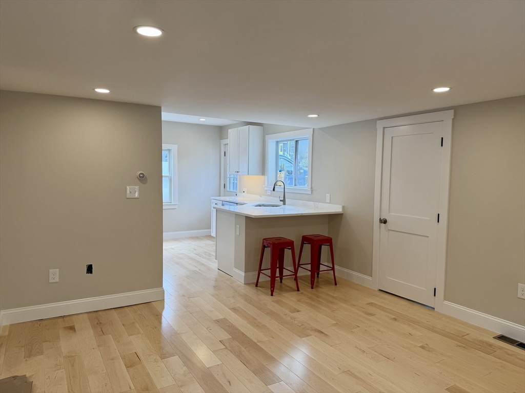 15 River Street, Unit 1 Beverly, MA 01915 - Photo 9 of 17 a view of room with furniture and wooden floor