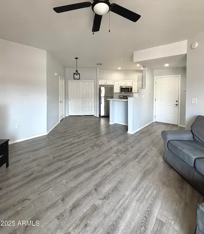 a view of kitchen with cabinets and wooden floor