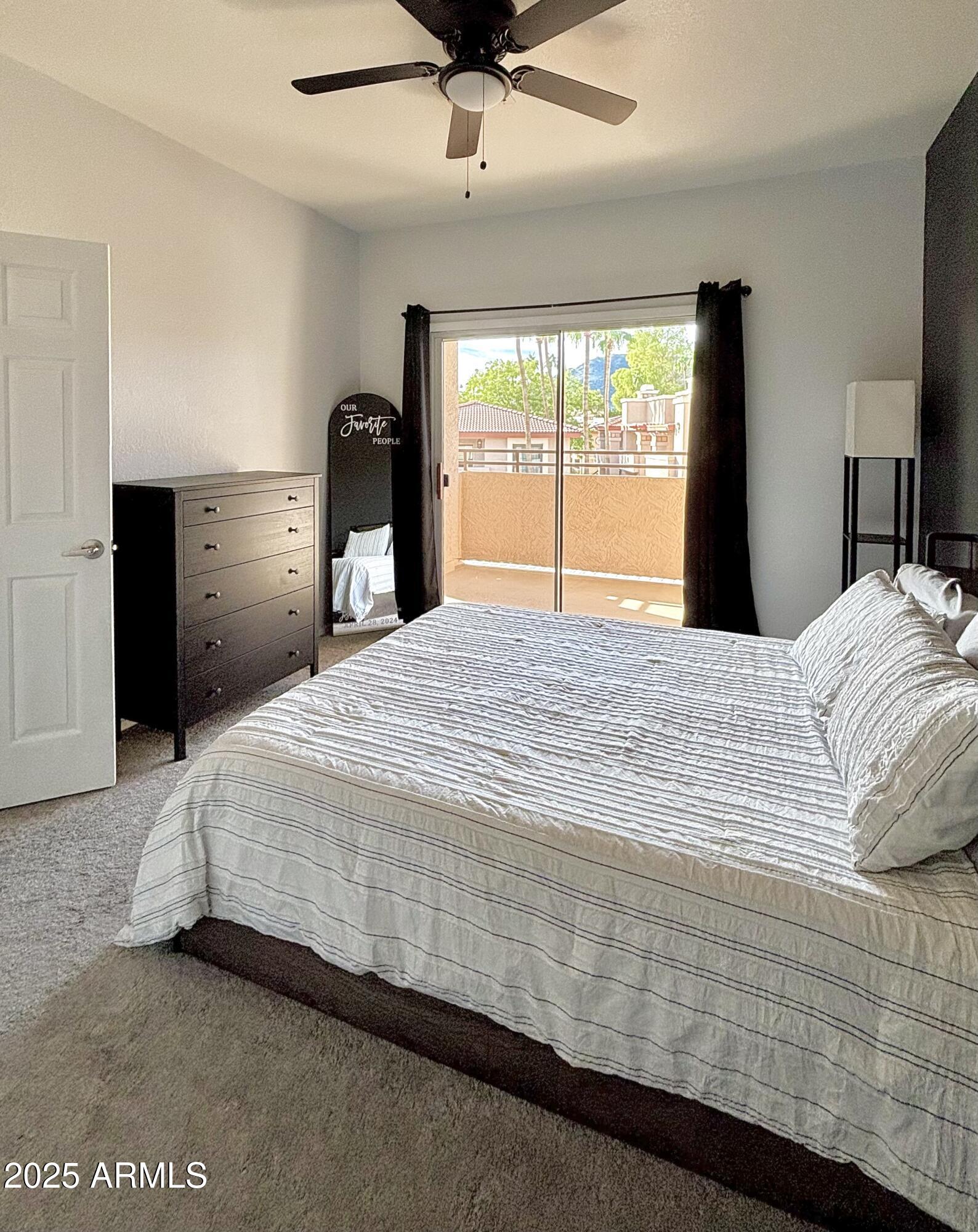 10410 North Cave Creek Road, Unit 2005 Phoenix, AZ 85020 - Photo 7 of 22 a bedroom with a bed and a large window