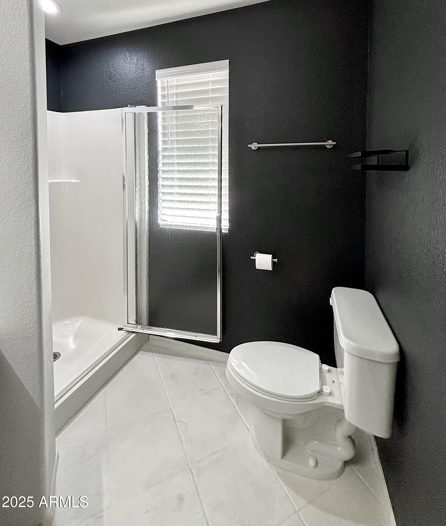 10410 North Cave Creek Road, Unit 2005 Phoenix, AZ 85020 - Photo 9 of 22 a white toilet sitting next to a bathroom sink