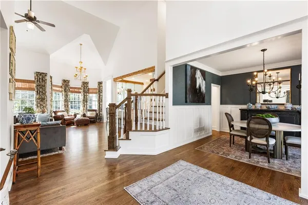 a living room with furniture and a floor to ceiling window