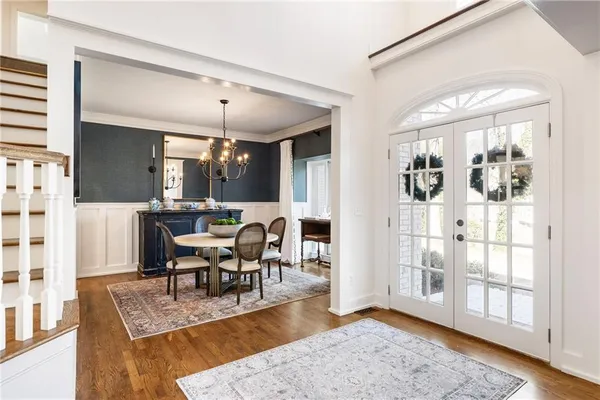 a living room with furniture large window and a fireplace