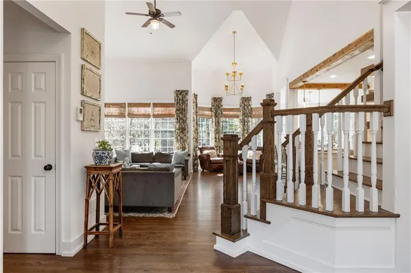 a living room with furniture a table and a fireplace
