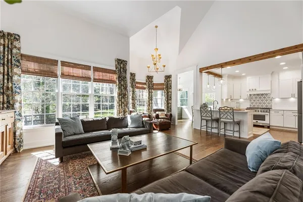 a view of living room with granite countertop furniture and a chandelier
