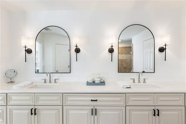 front view of house with a potted plant windows