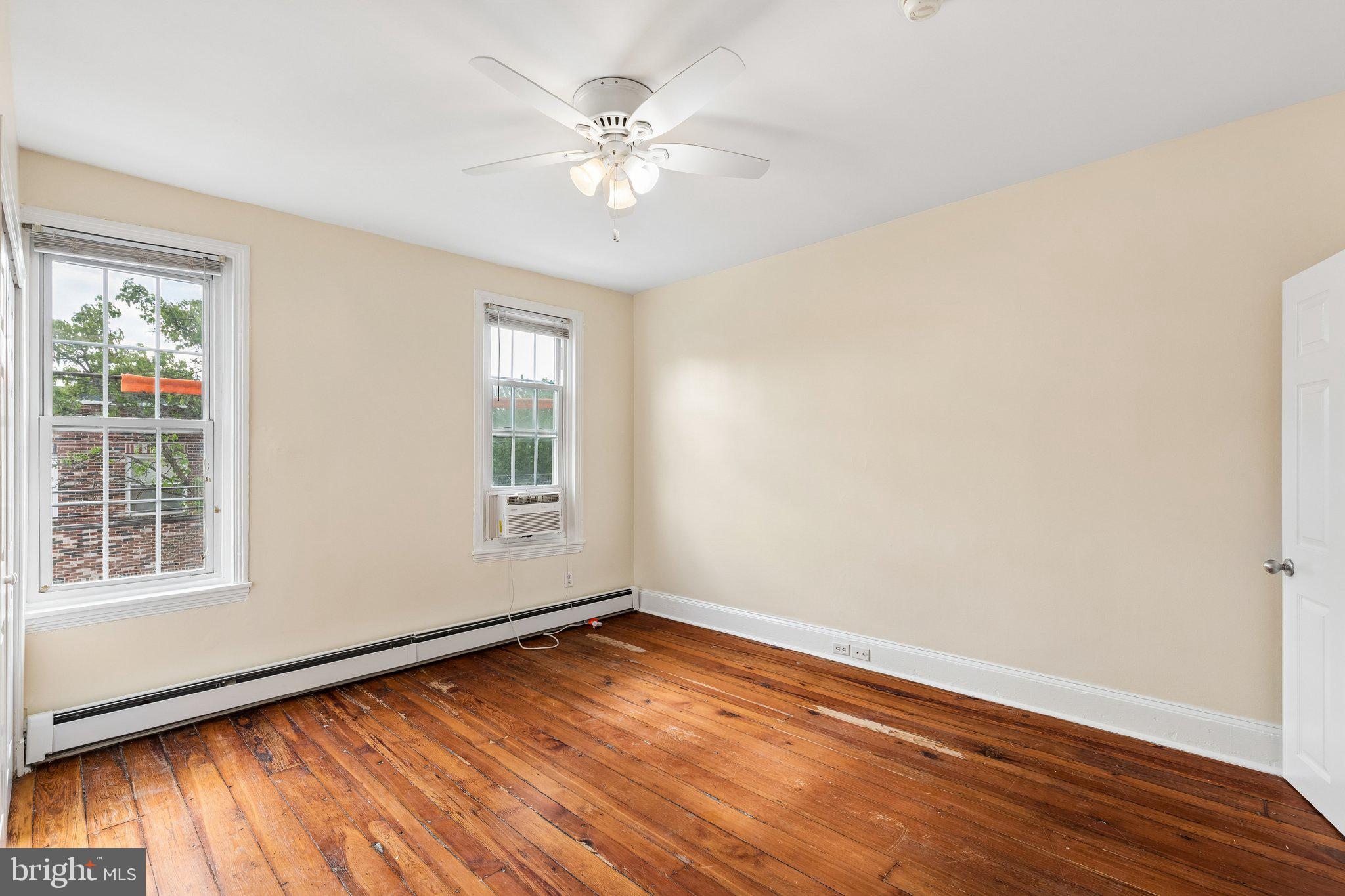 714 South 18th Street Philadelphia, PA 19146 - Photo 14 of 28 a view of empty room with wooden floor and fan